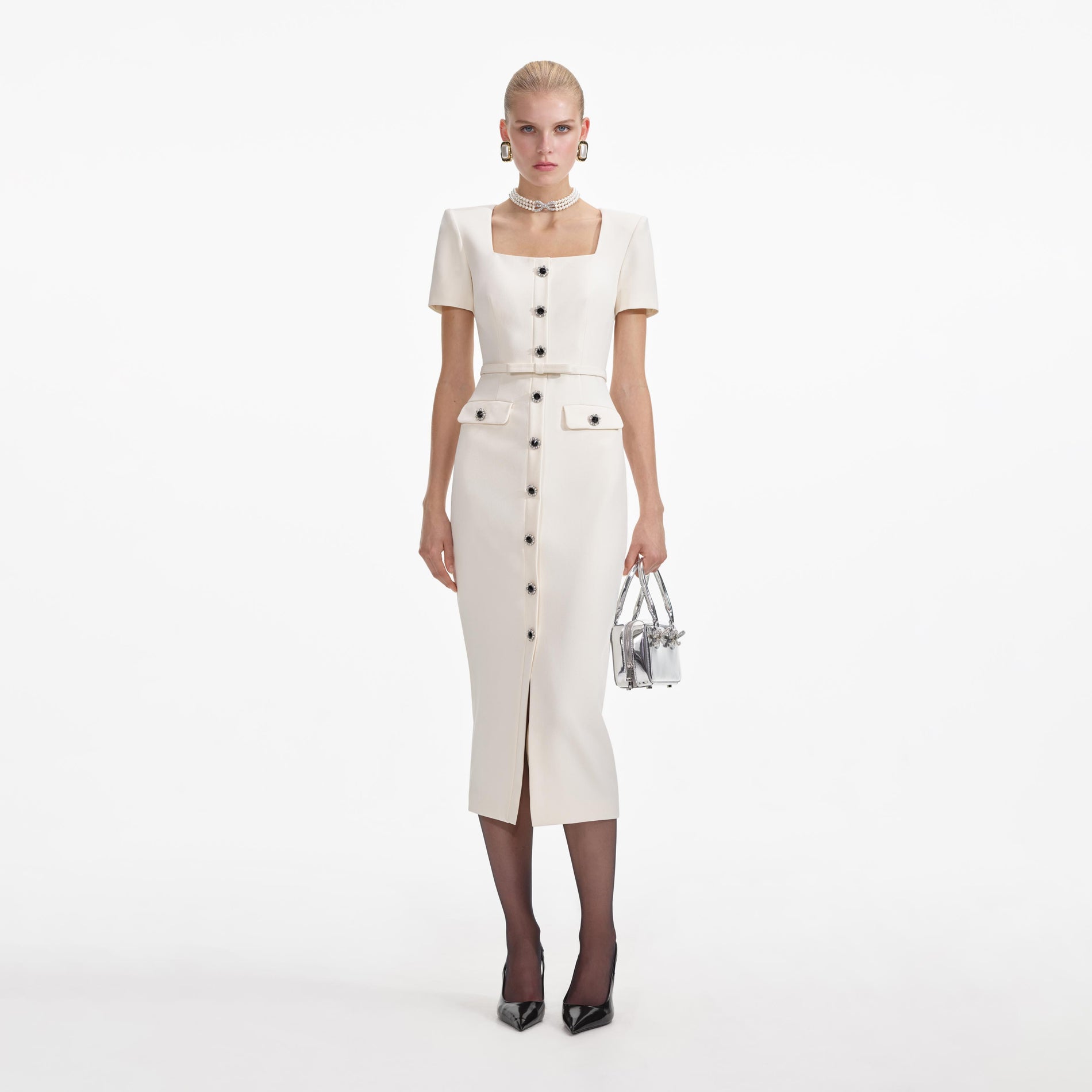 Front view of a woman wearing the Cream Crepe Button Midi Dress