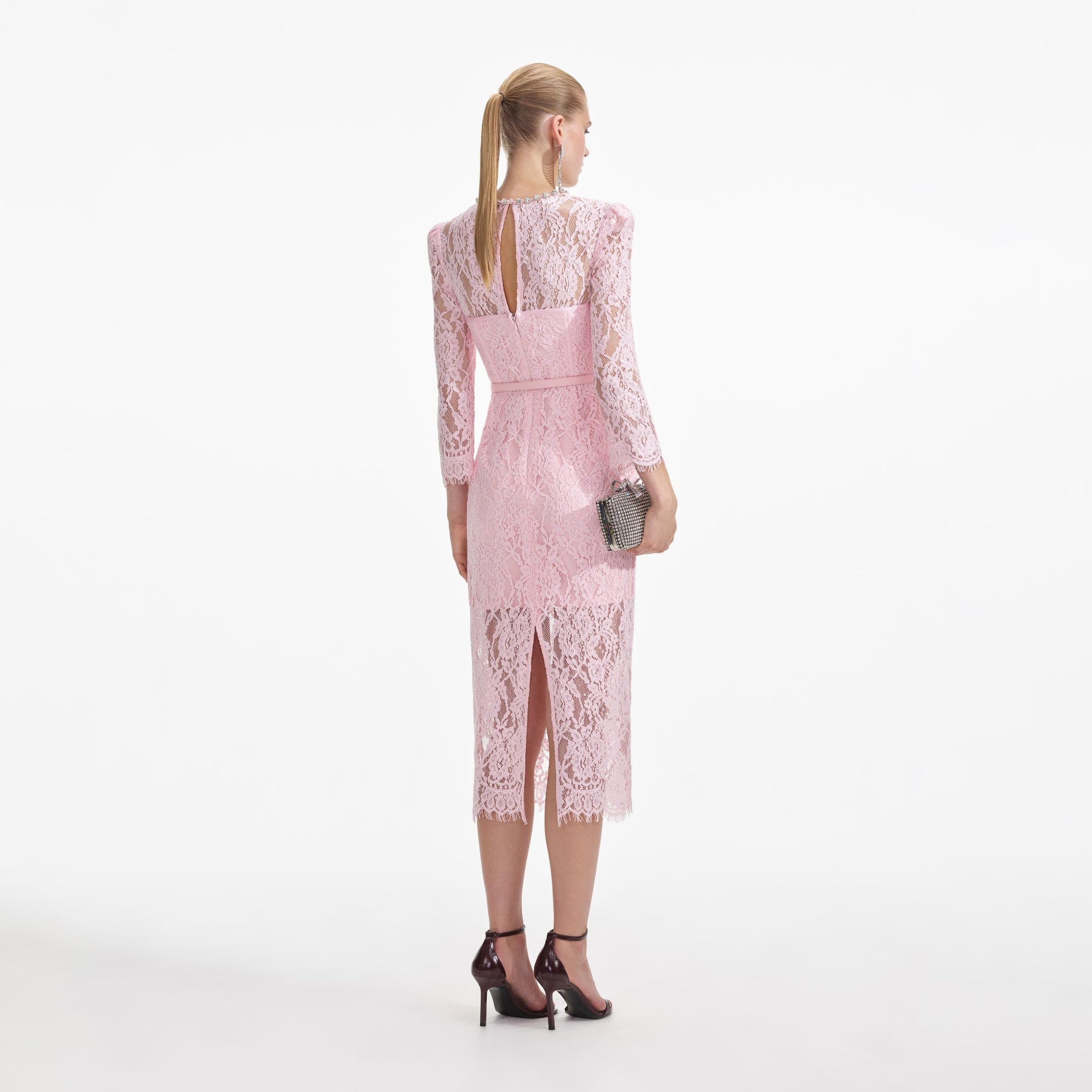 Back view of a woman wearing the Pink Lace Bustier Midi Dress