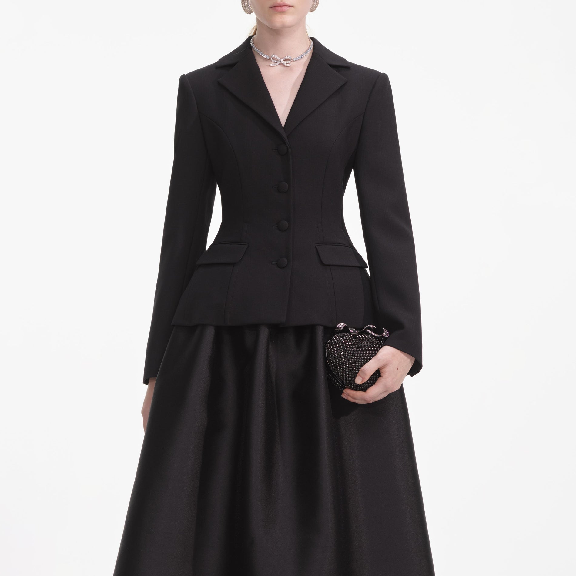 A close up of a woman wearing the Black Tailored Midi Dress