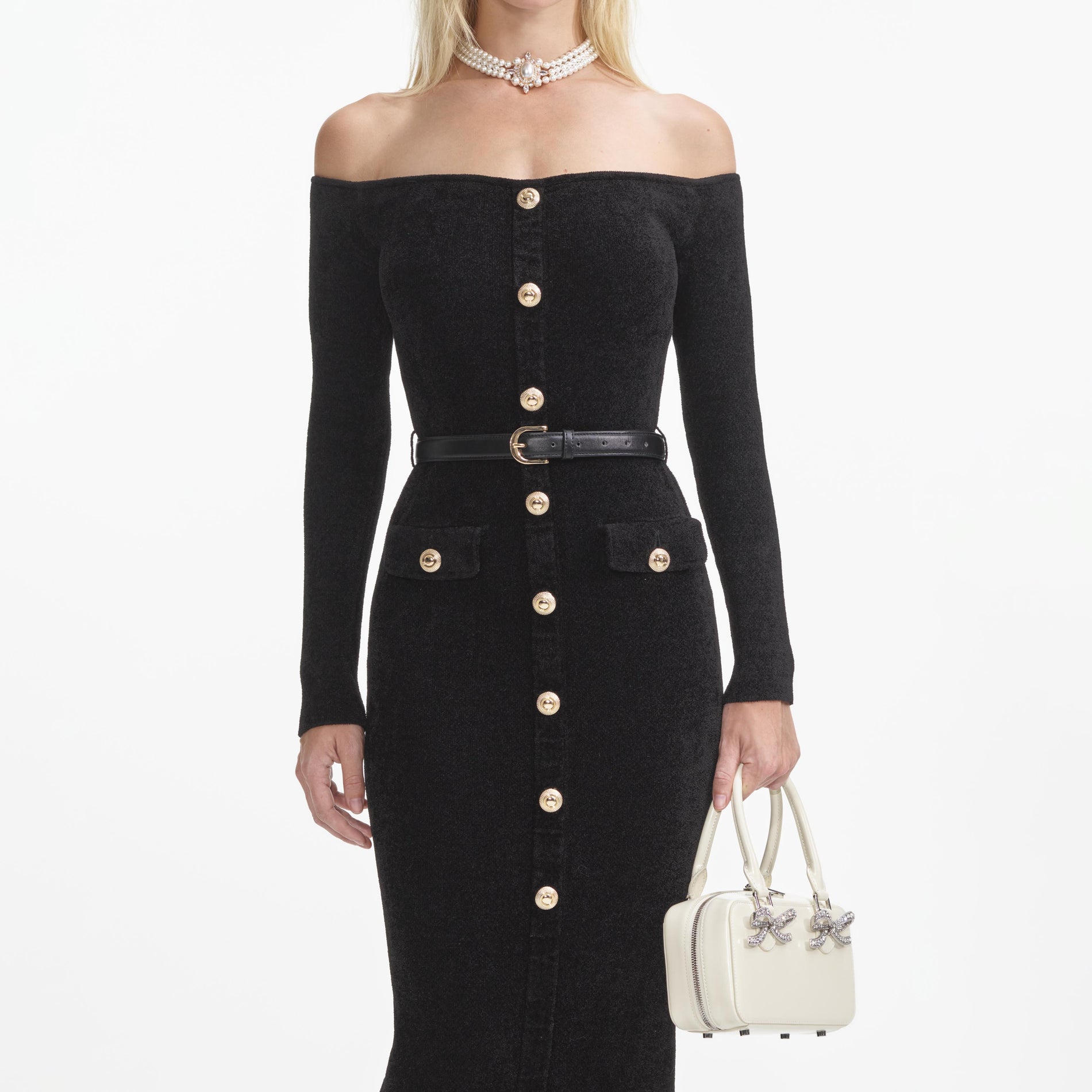A close up of a woman wearing the Black Chenille Knit Midi Dress