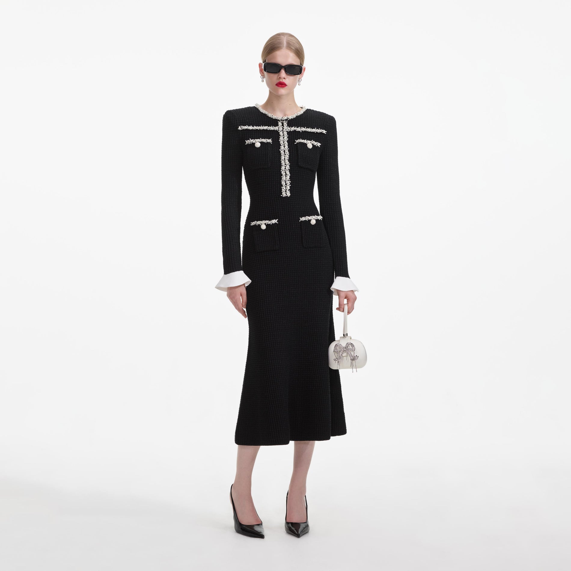 Front view of a woman wearing the Black Pearl Trim Knit Midi Dress