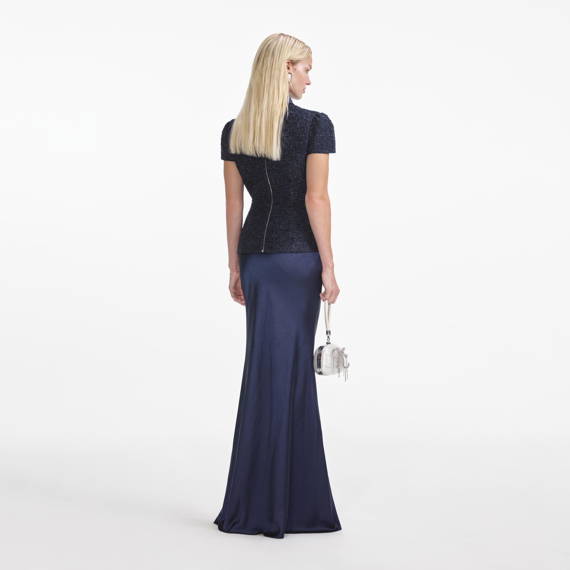 Back view of a woman wearing the Navy Metallic Boucle Maxi Dress