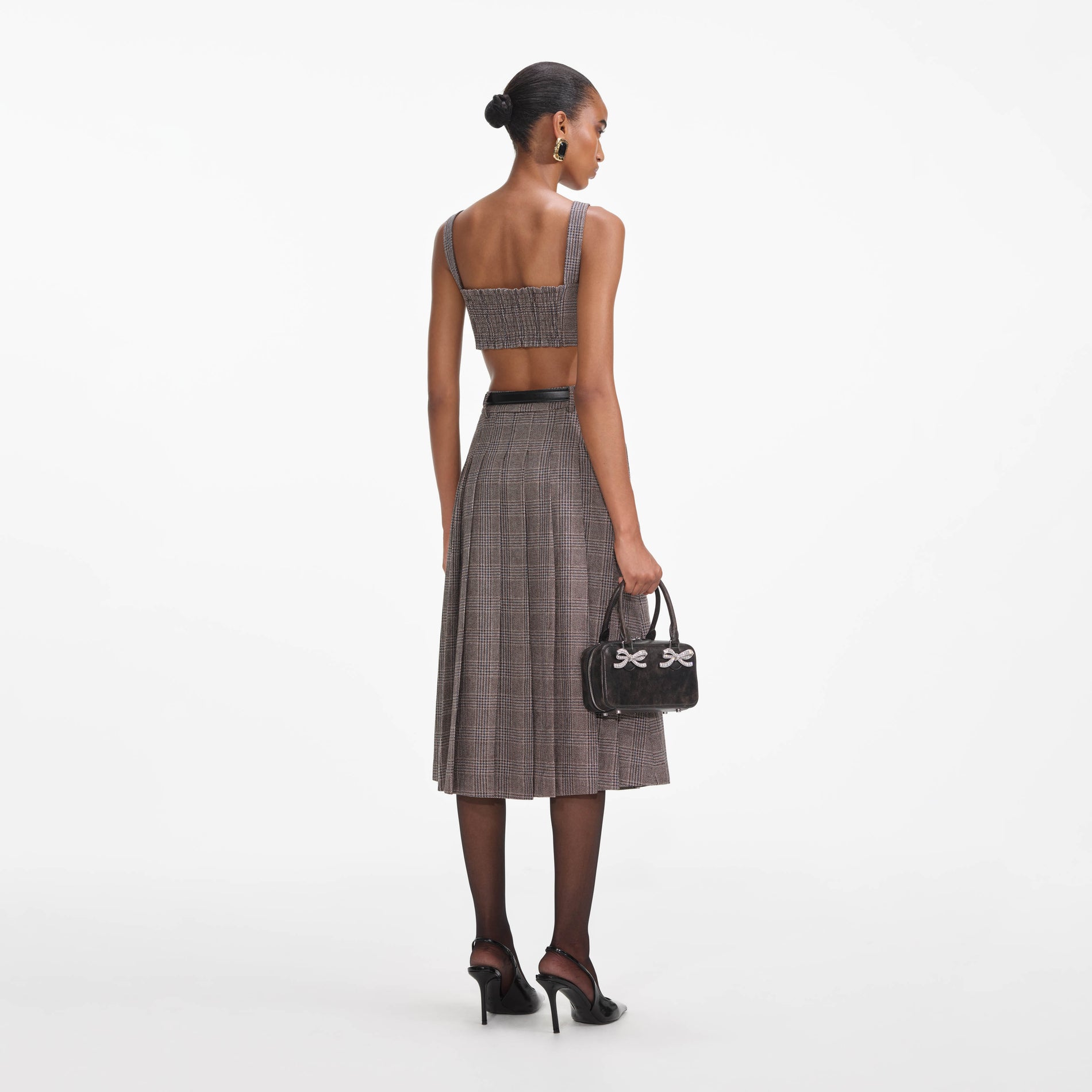 Back view of a woman wearing the Brown Check Crop Top