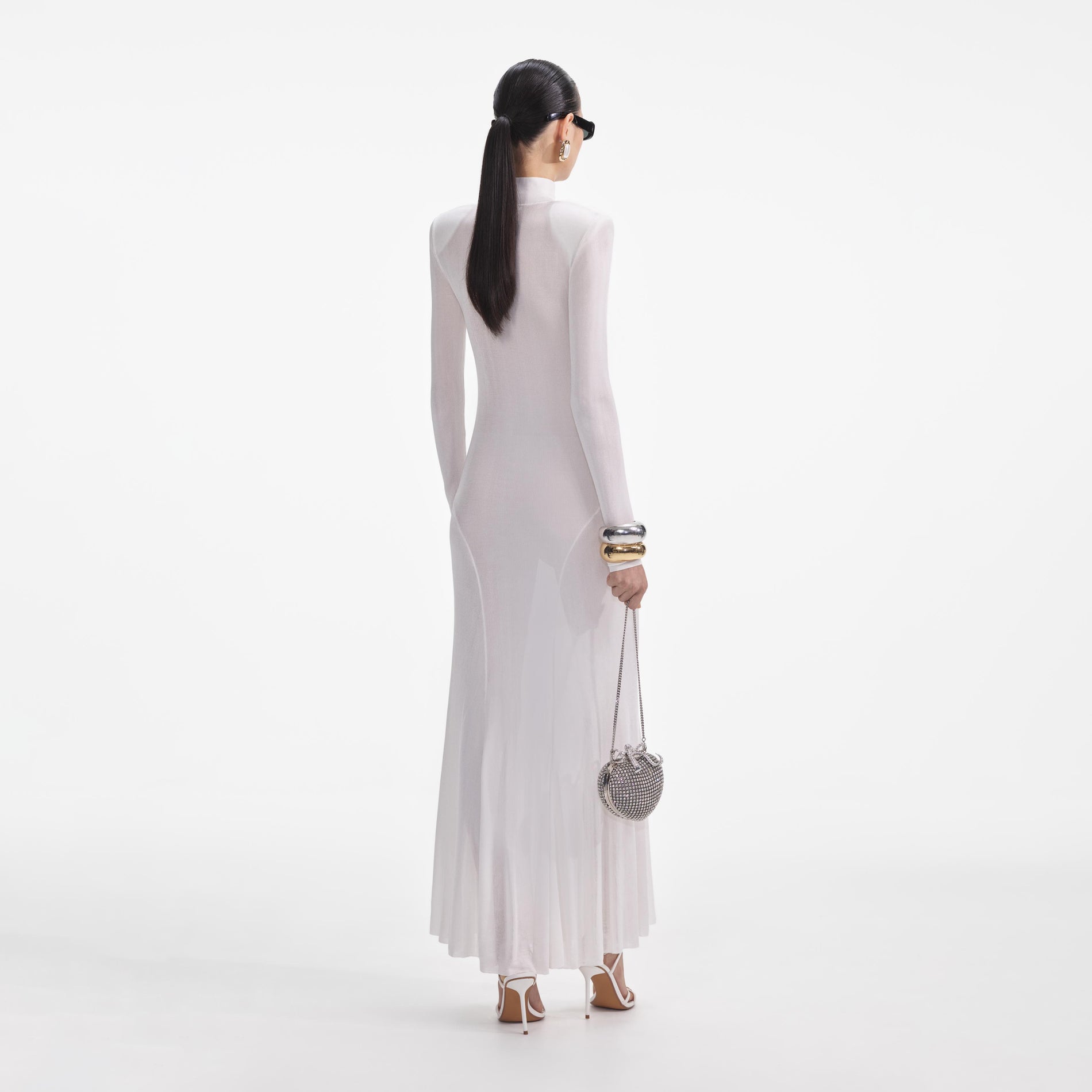 Back view of a woman wearing the White Viscose Knit Maxi Dress