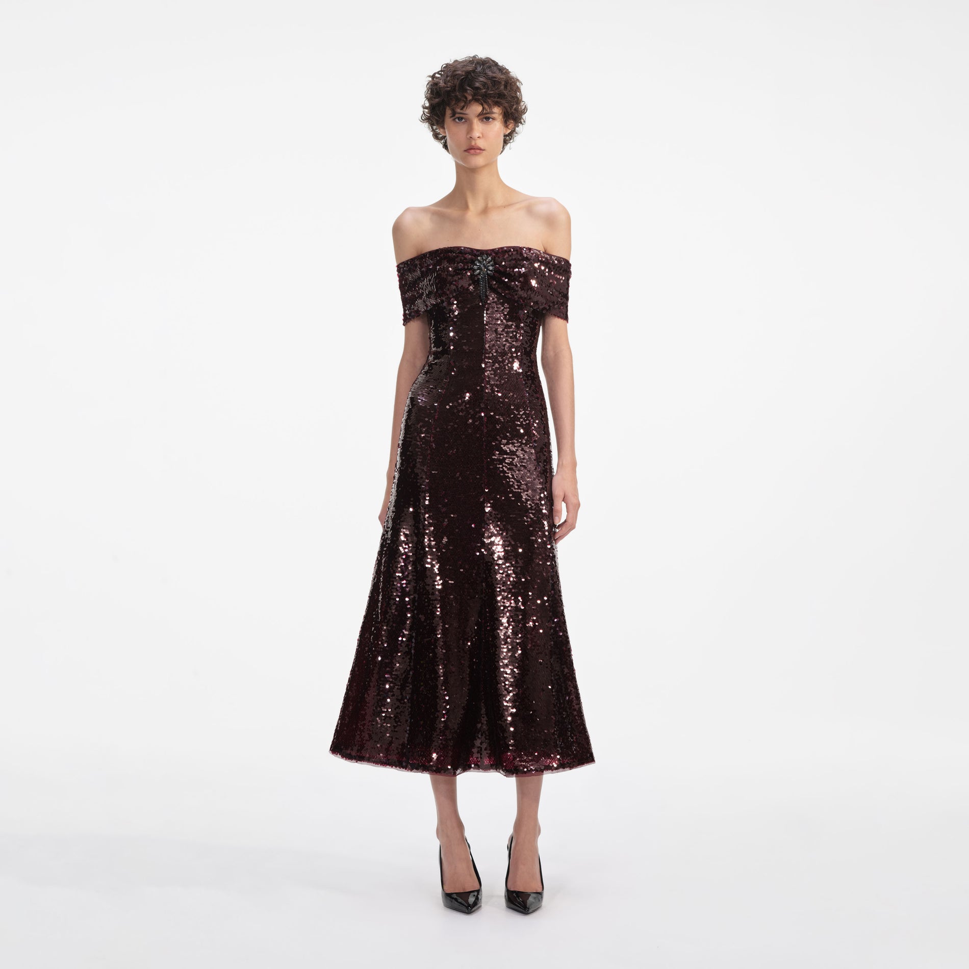 Front view of a woman wearing the Brown Sequin Off Shoulder Midi Dress