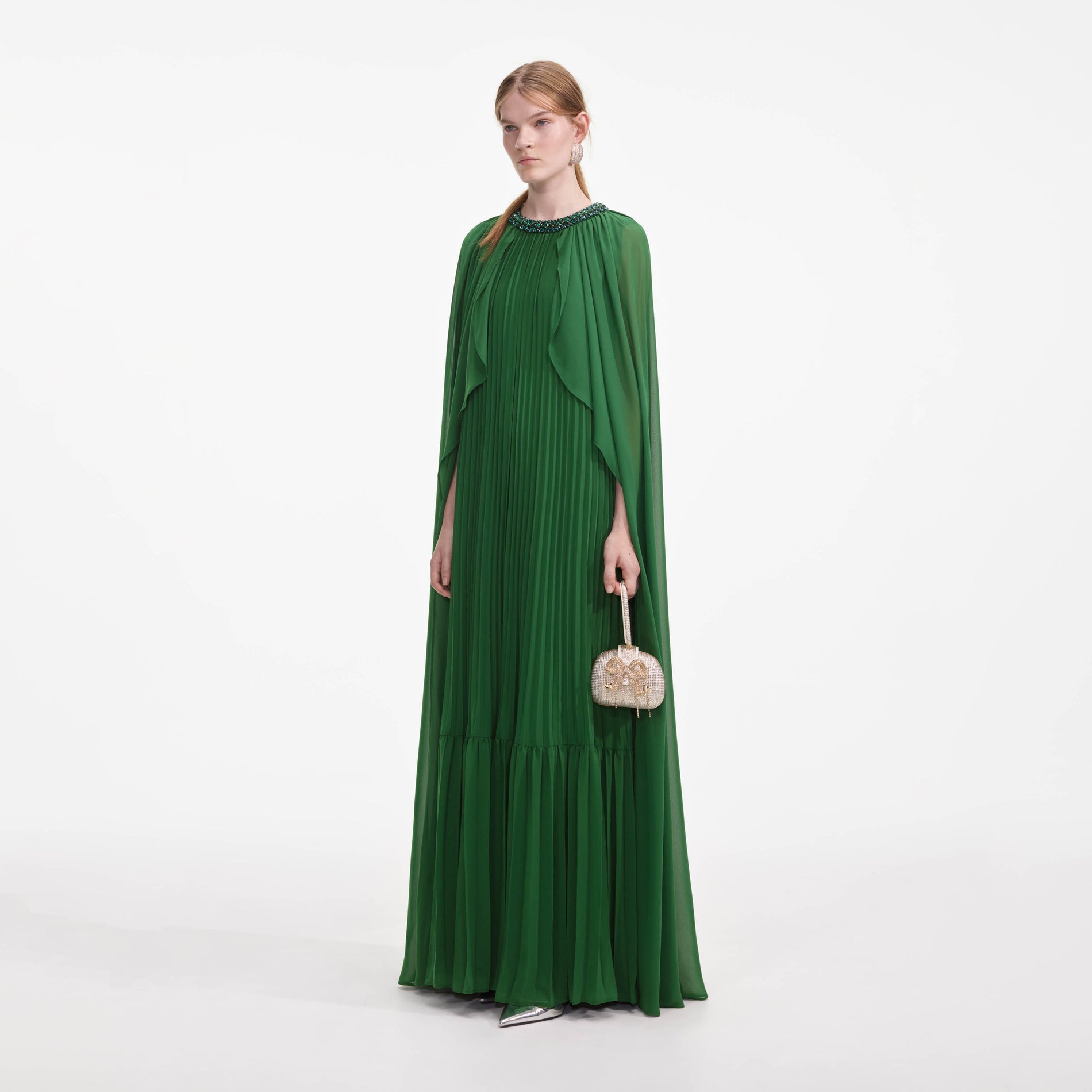 Side view of a woman wearing the Green Chiffon Cape Maxi Dress