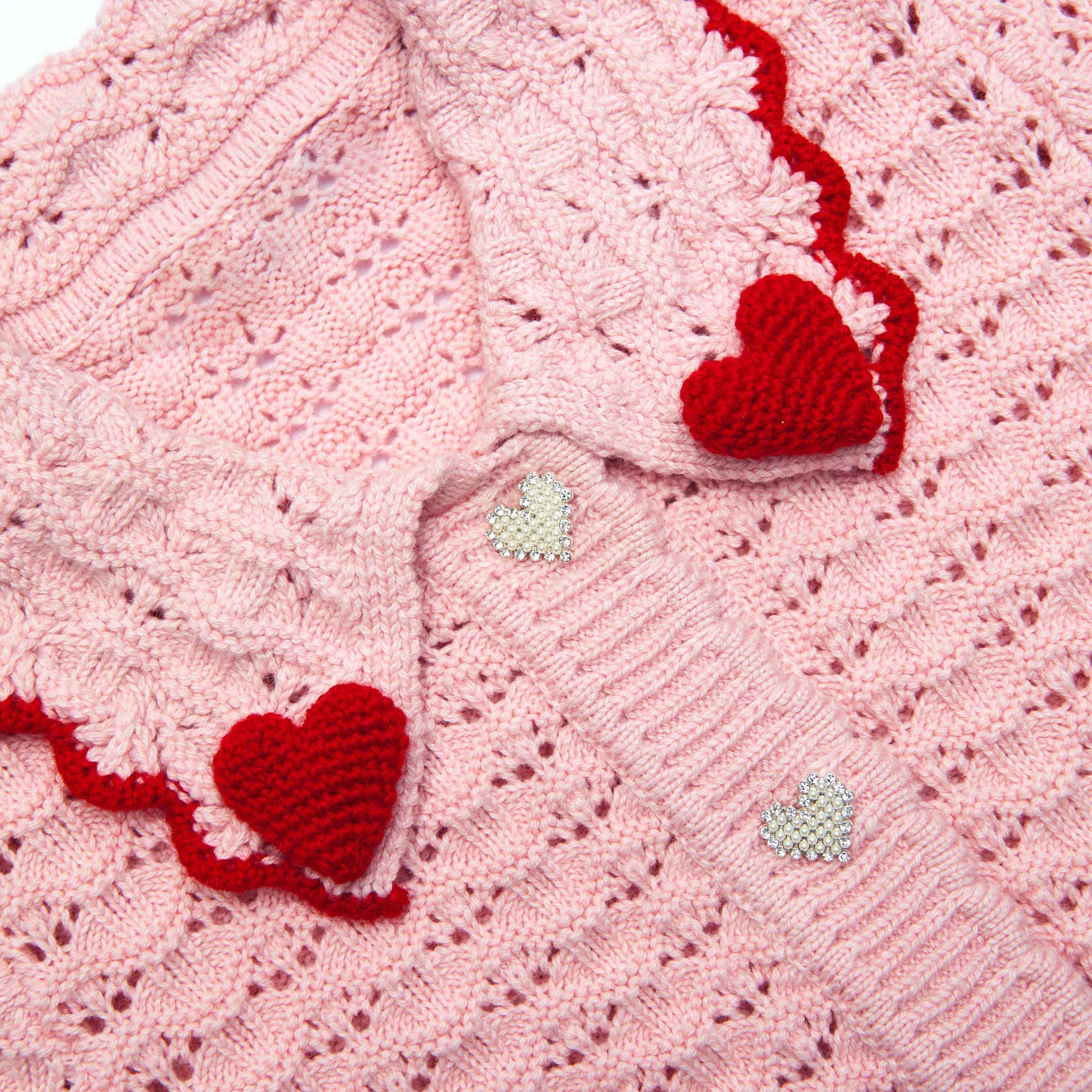 Back view of a woman wearing the Pink Textured Heart Detail Cardigan