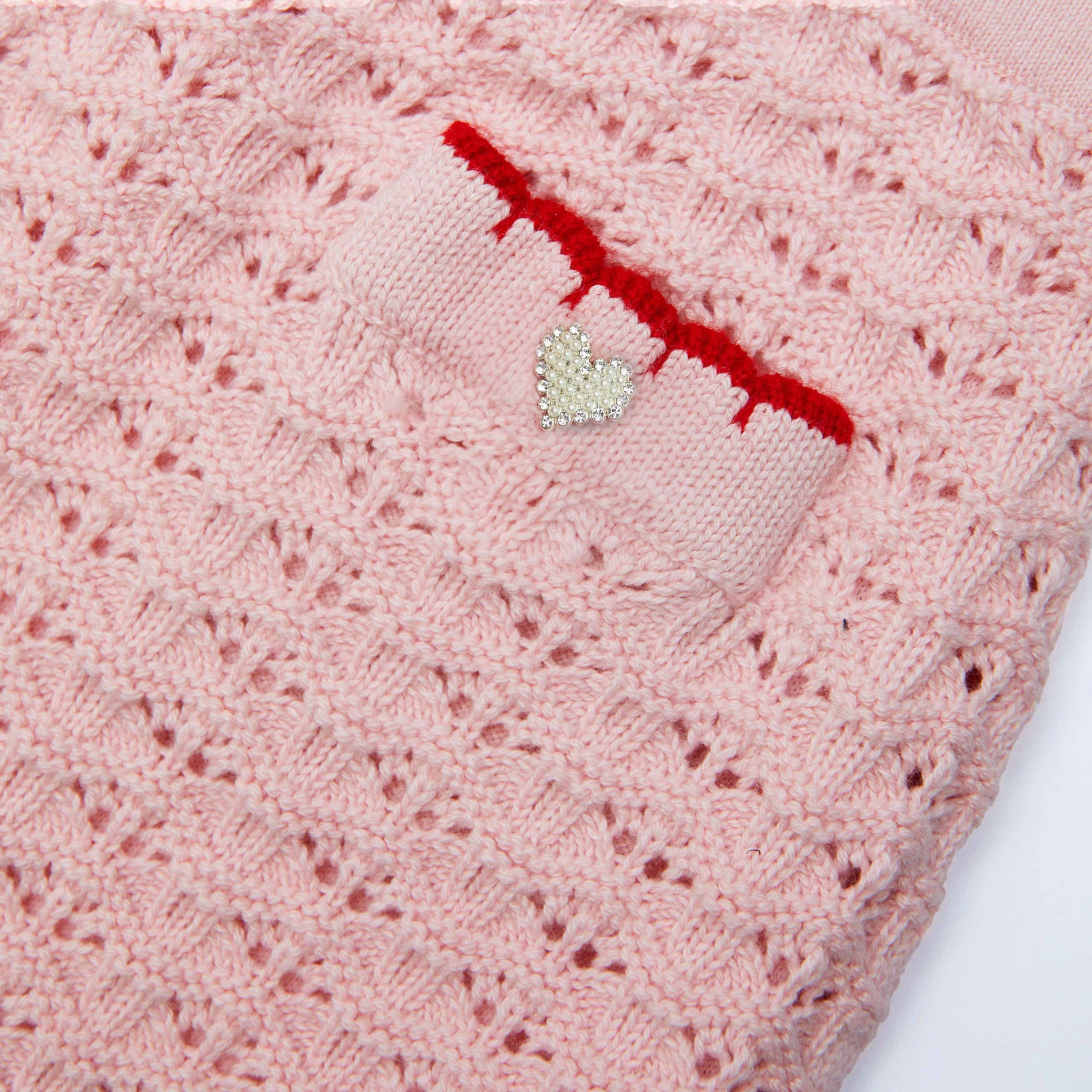 Back view of a woman wearing the Pink Textured Knit Heart Detail Skirt