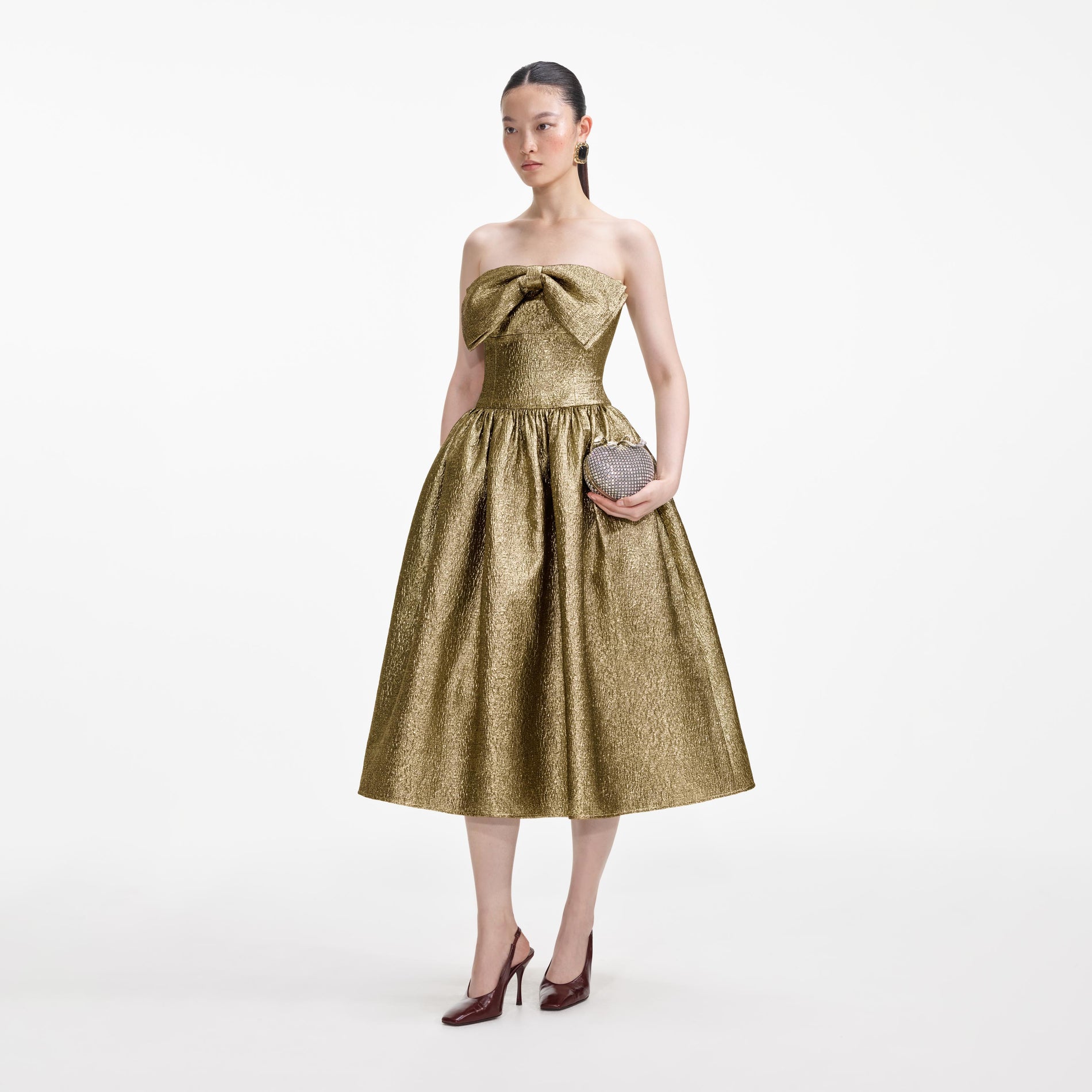 Side view of a woman wearing the Gold Metallic Jacquard Midi Dress
