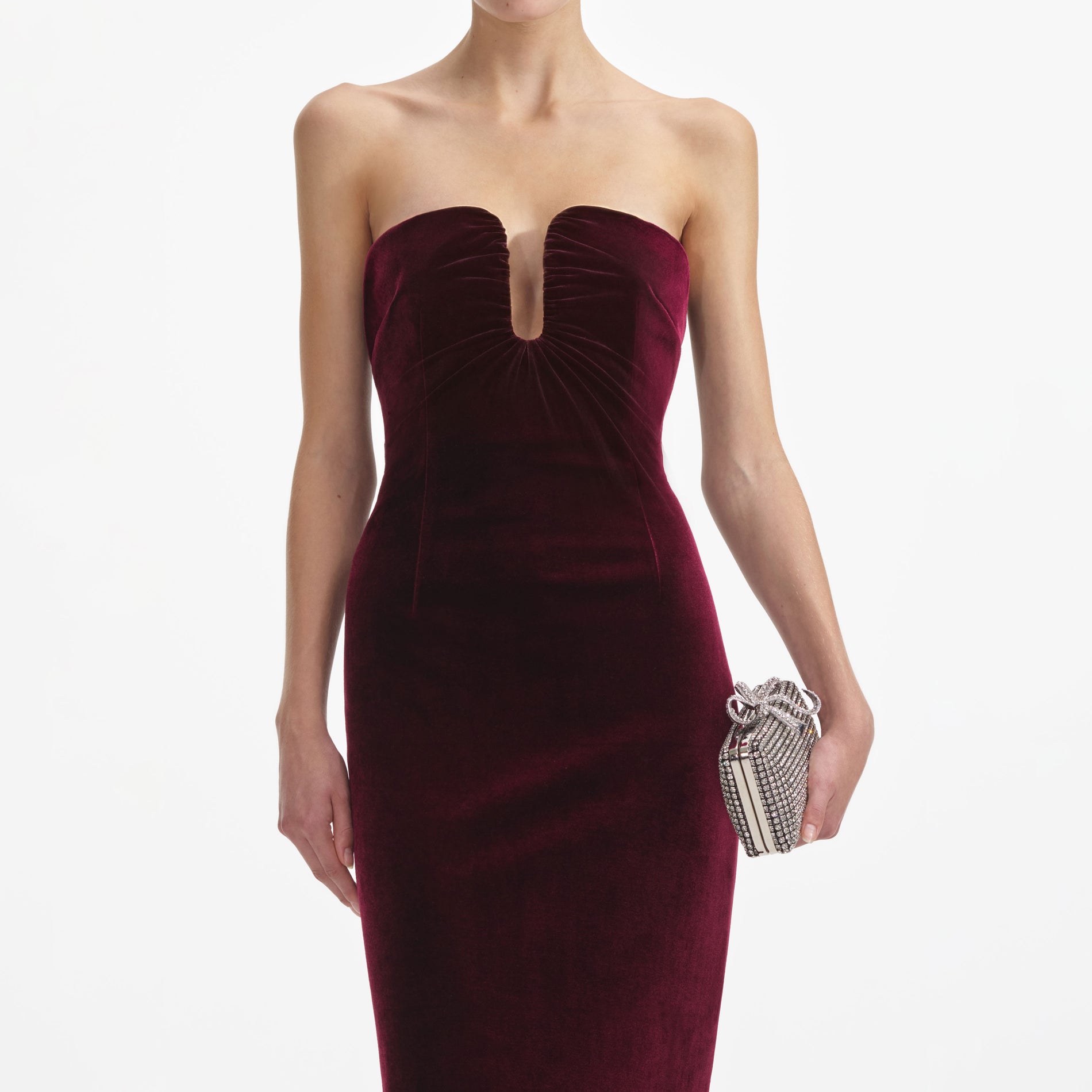 A close up of a woman wearing the Burgundy Velvet Midi Dress