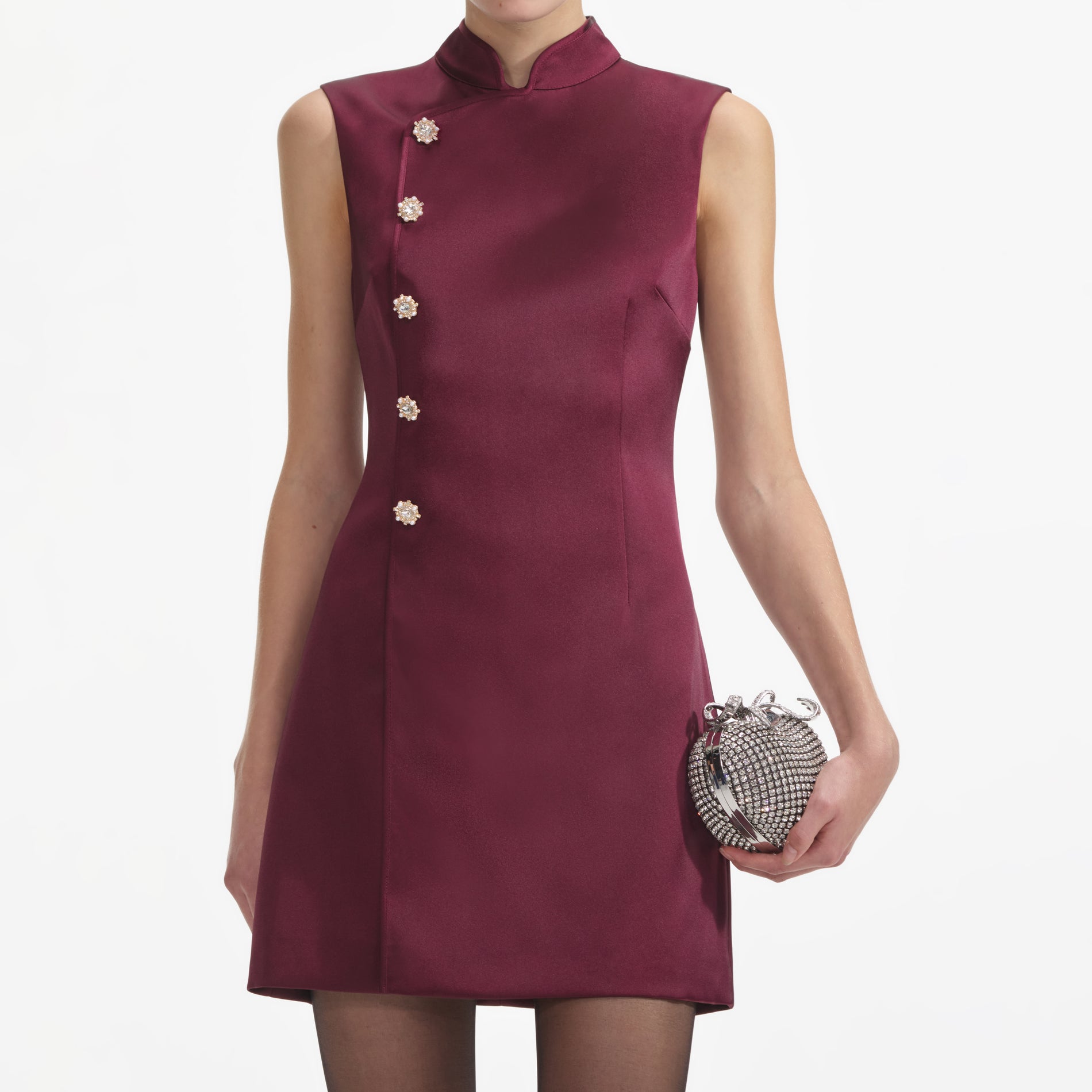 A close up of a woman wearing the Bordeaux Satin Mini Dress
