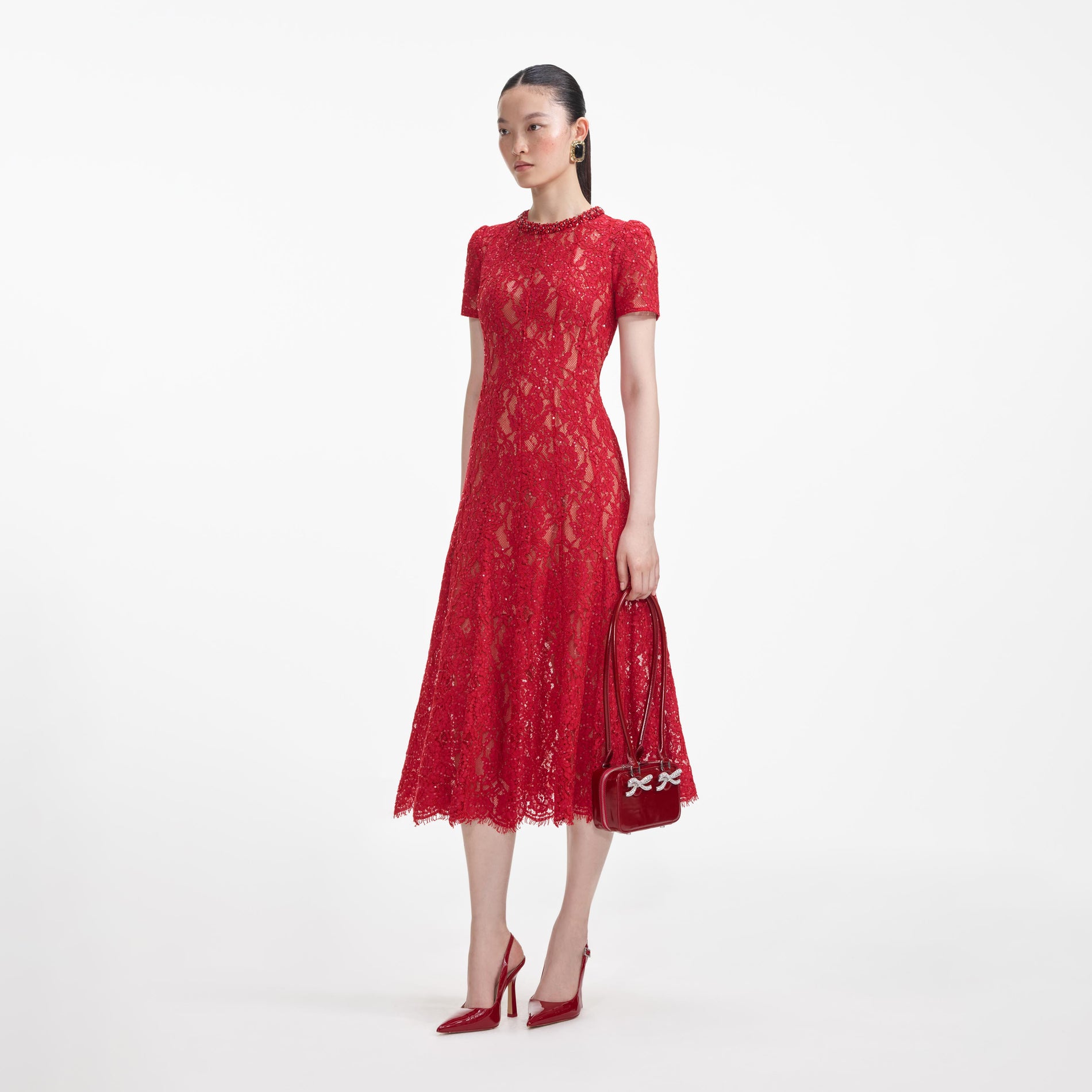 Side view of a woman wearing the Red Sequin Lace Midi Dress