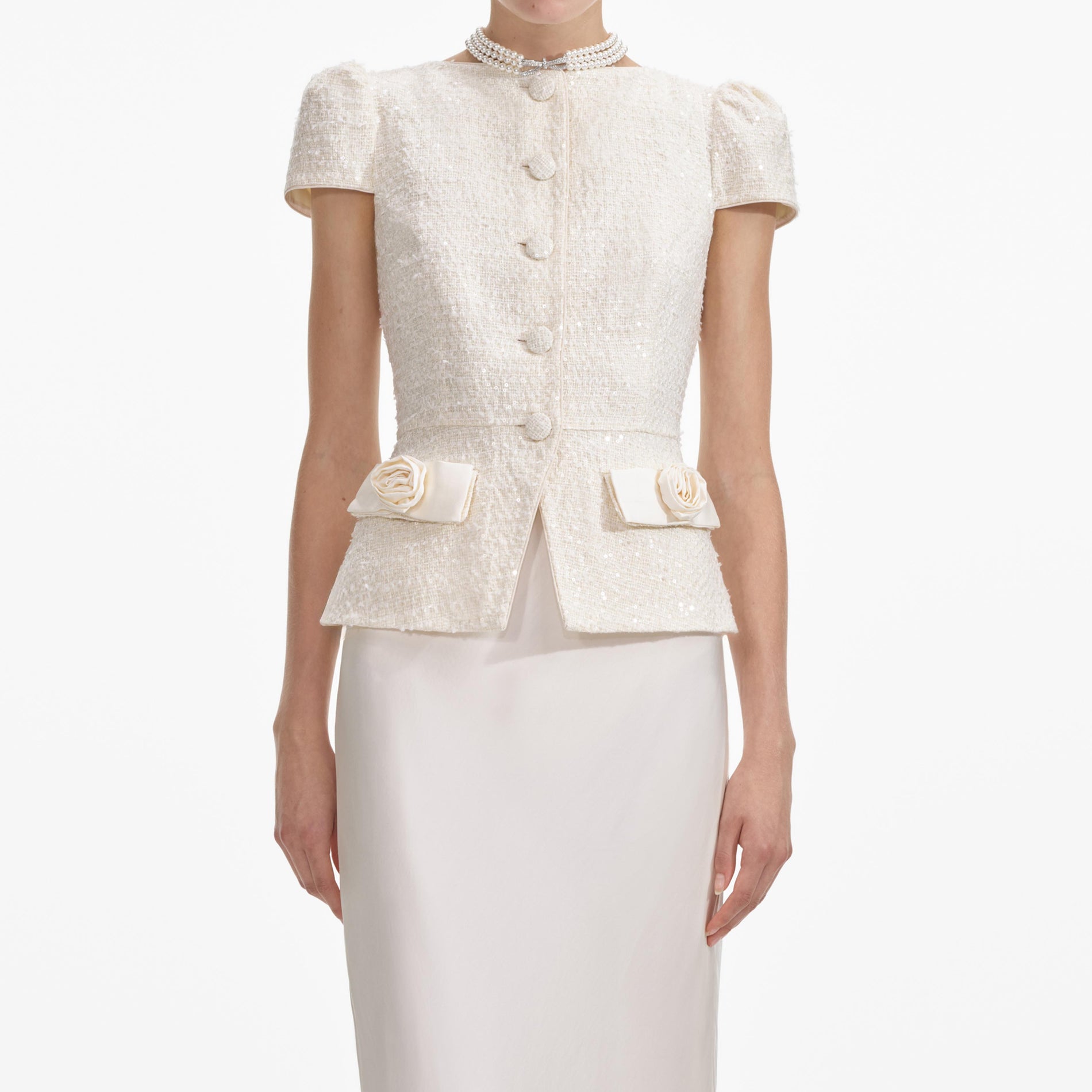 A close up of a woman wearing the Cream Boucle Bow Detail Maxi Dress