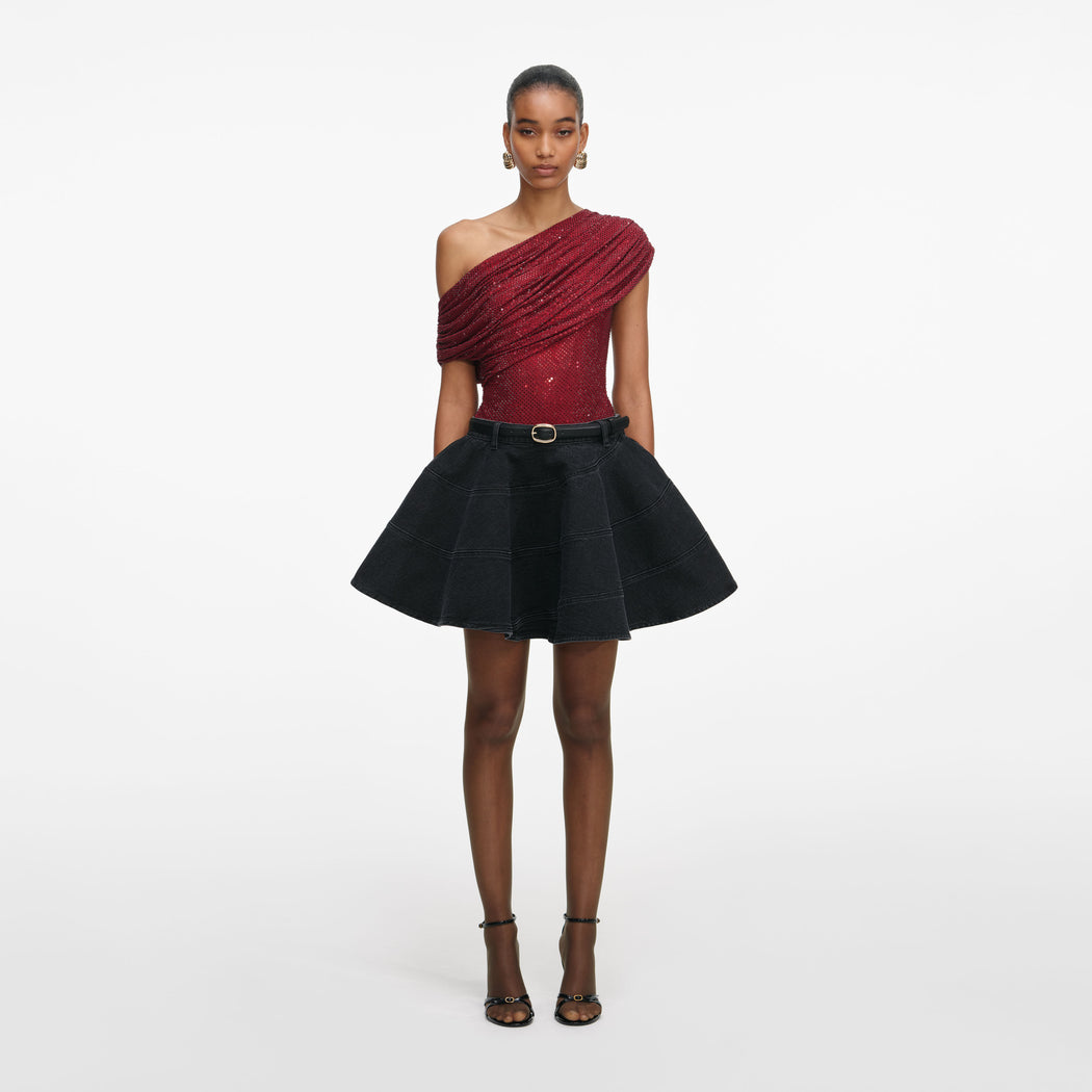 Front view of a woman wearing the Burgundy Rhinestone Drape Top