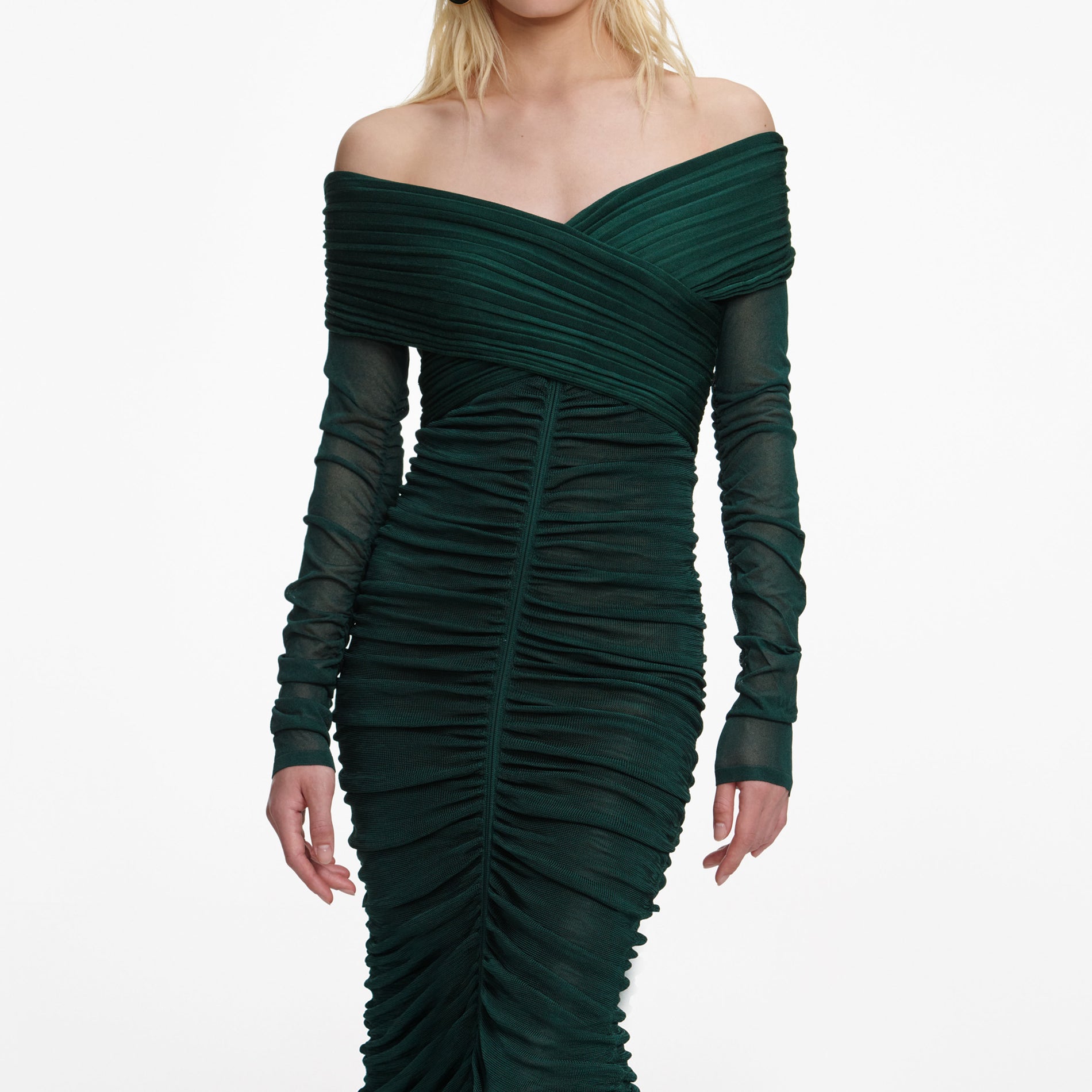 A close up of a woman wearing the Green Viscose Knit Midi Dress