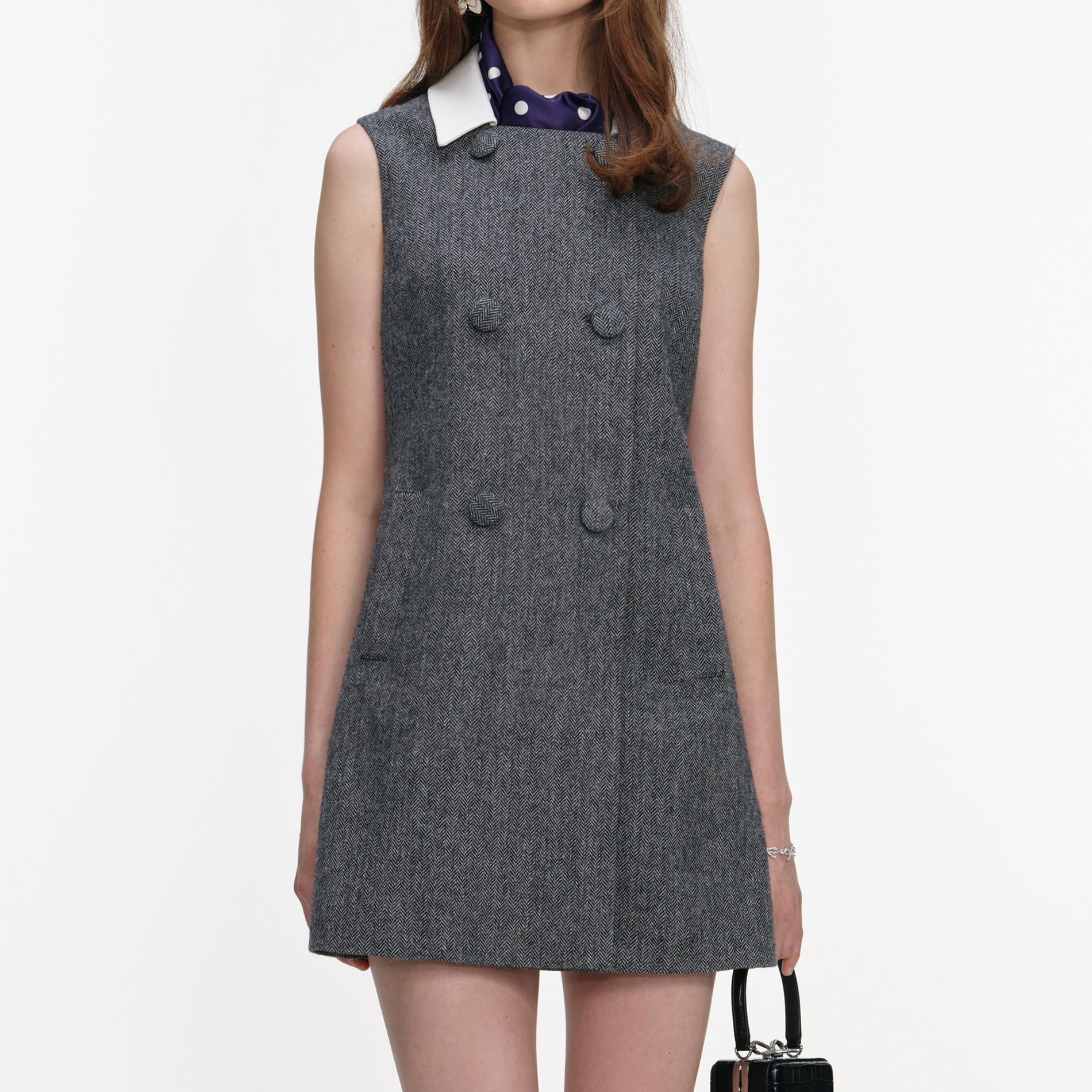 A close up of a woman wearing the Grey Herringbone Scarf Detail Mini Dress