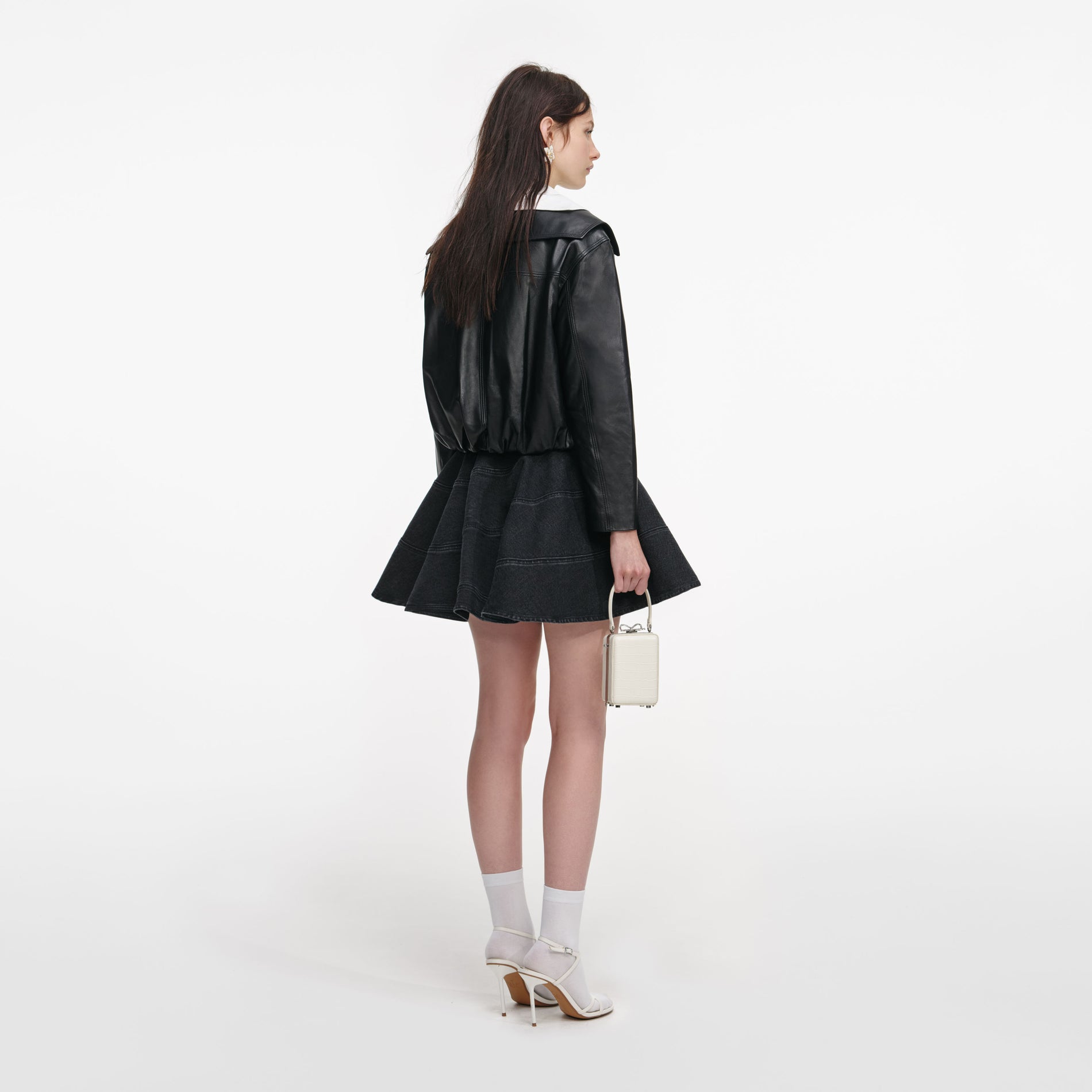 Back view of a woman wearing the Black Leather Contrast Collar Jacket