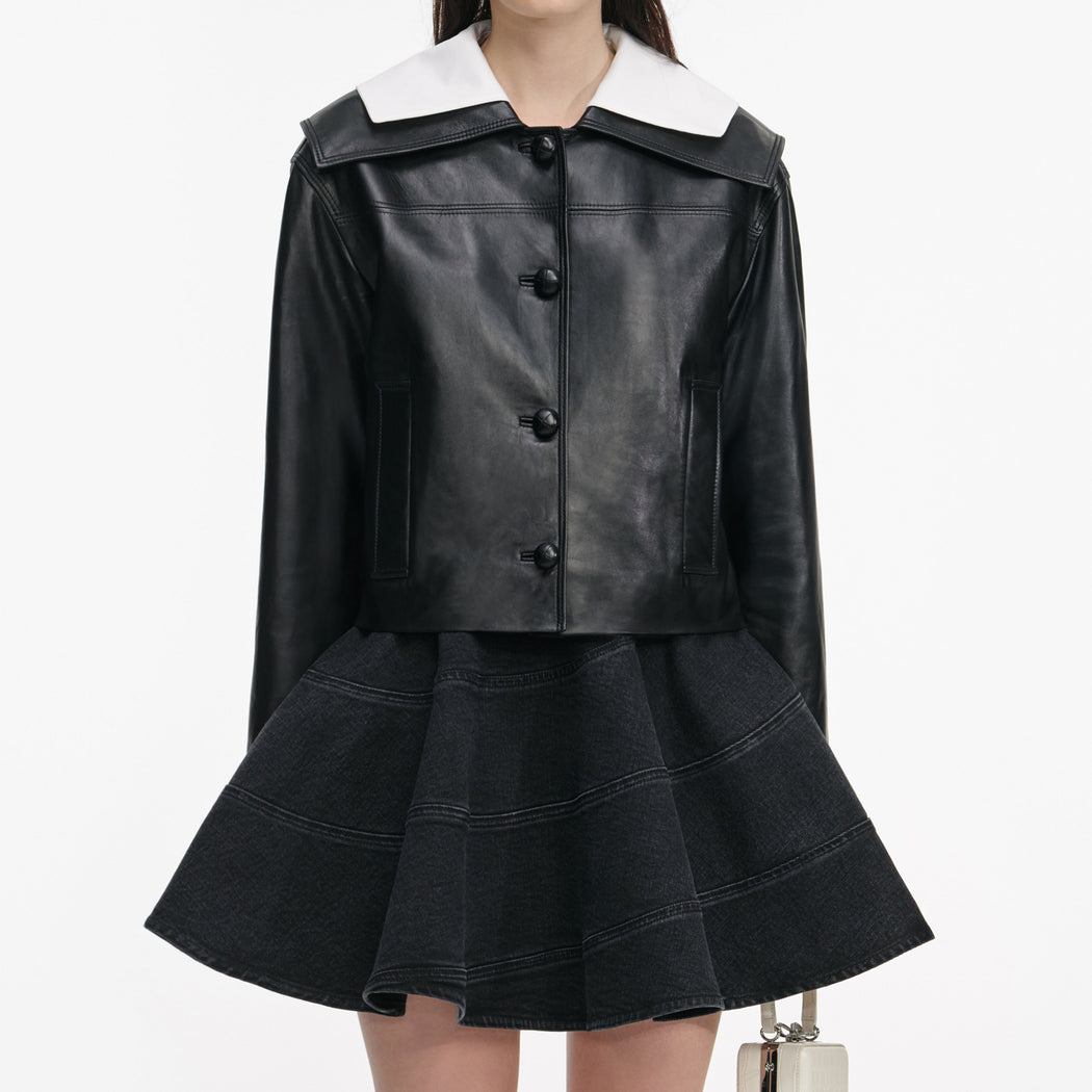 Side view of a woman wearing the Black Leather Contrast Collar Jacket