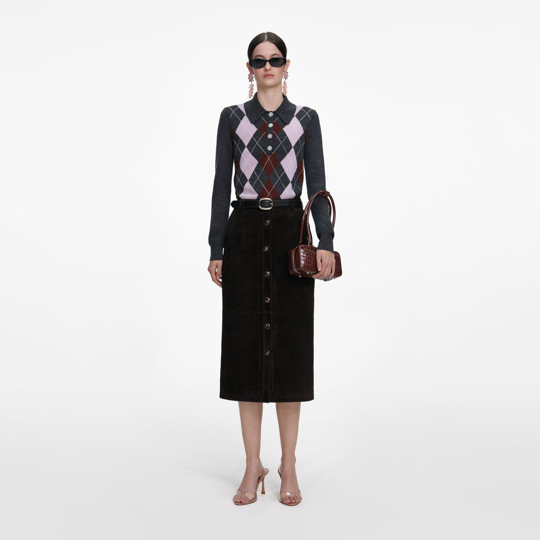 Front view of a woman wearing the Brown Suede Midi Skirt