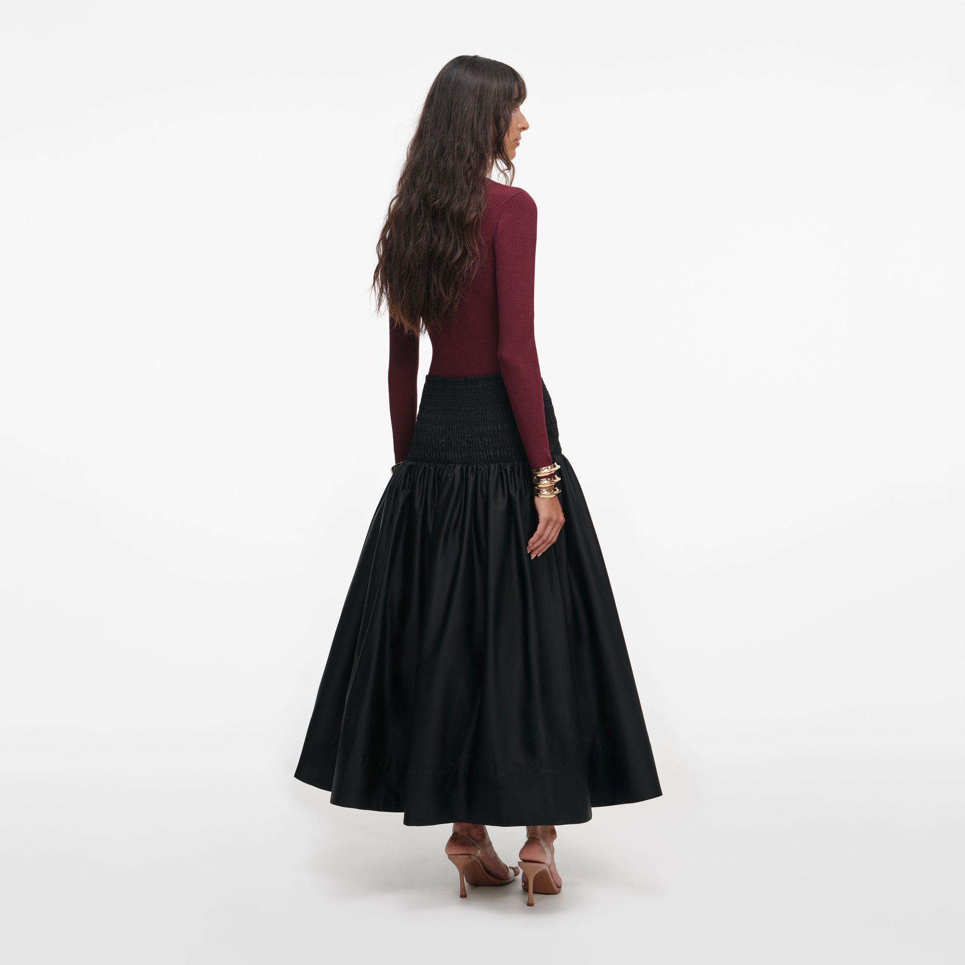 Back view of a woman wearing the Burgundy Keyhole Knit Top