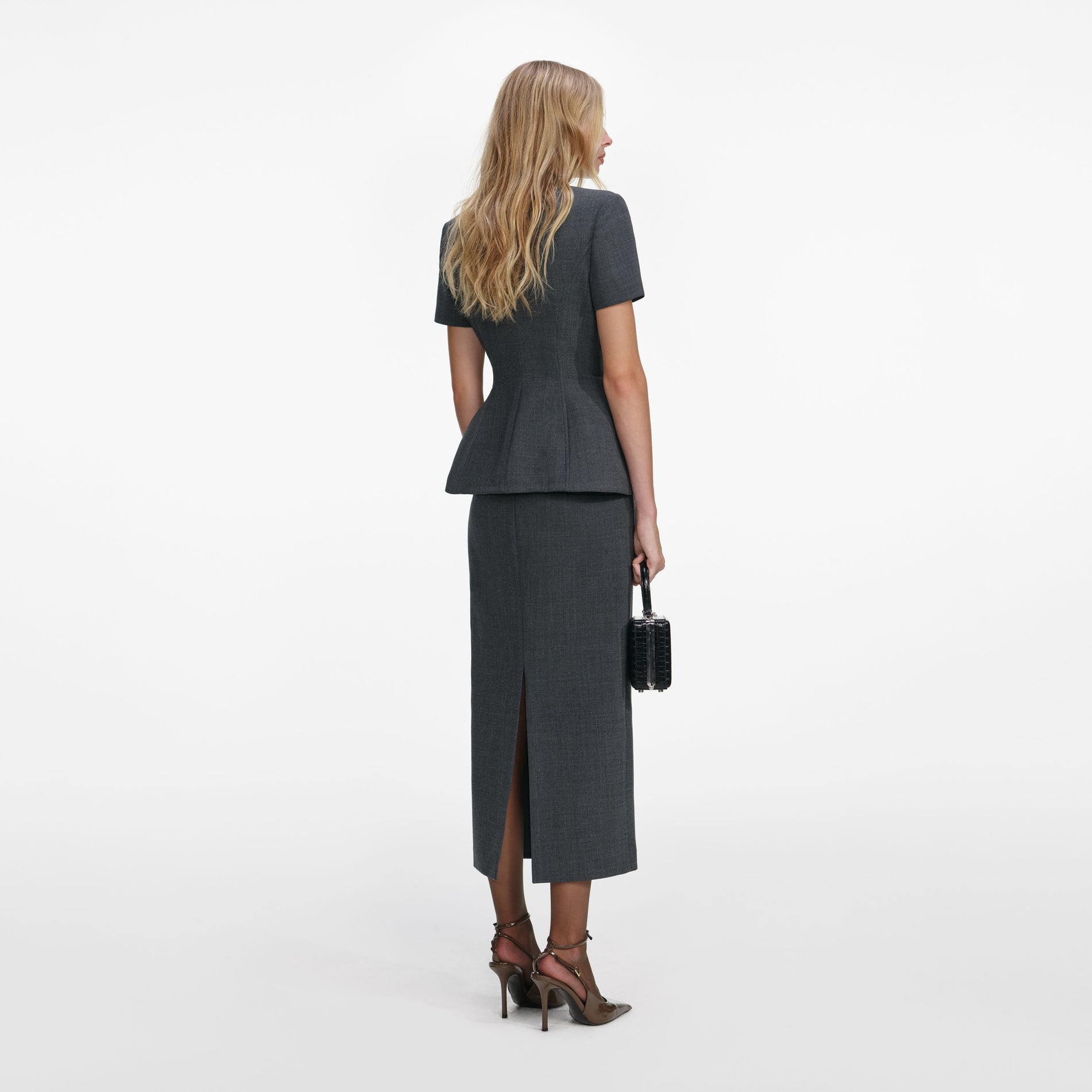 Back view of a woman wearing the Grey Tailored Flower Detail Midi Dress