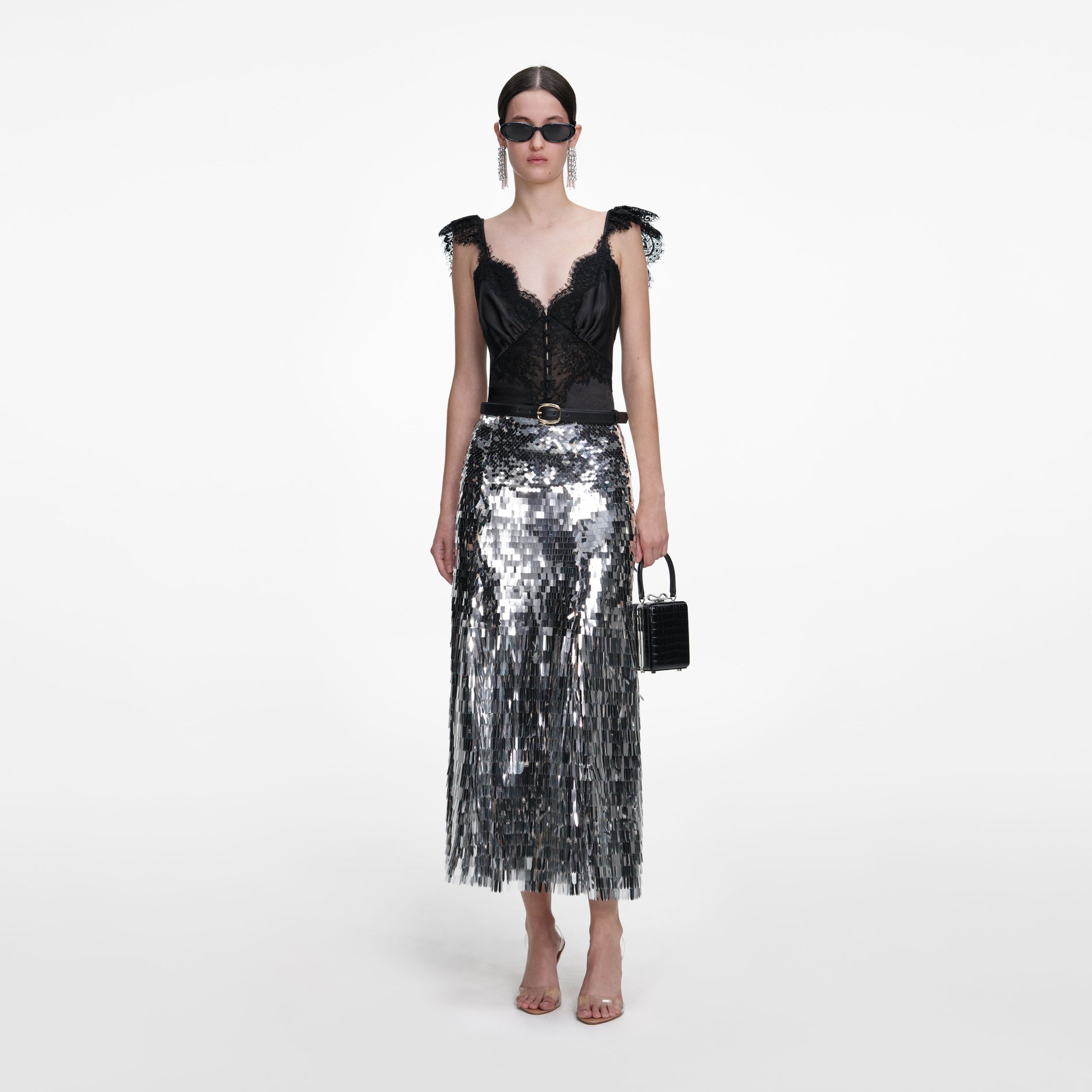 Front view of a woman wearing the Silver Gradient Sequin Midi Skirt