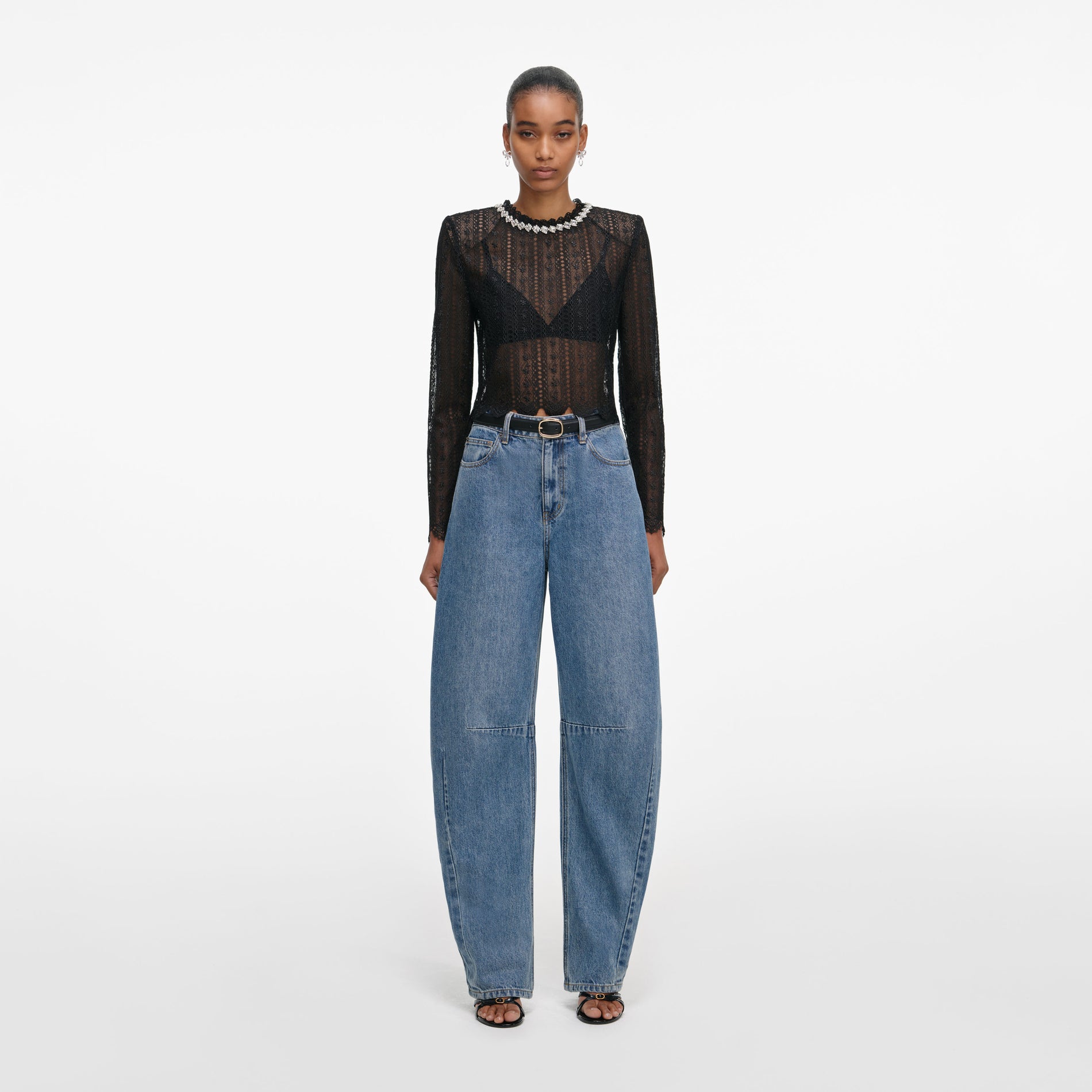 Front view of a woman wearing the Black Organza Lace Top