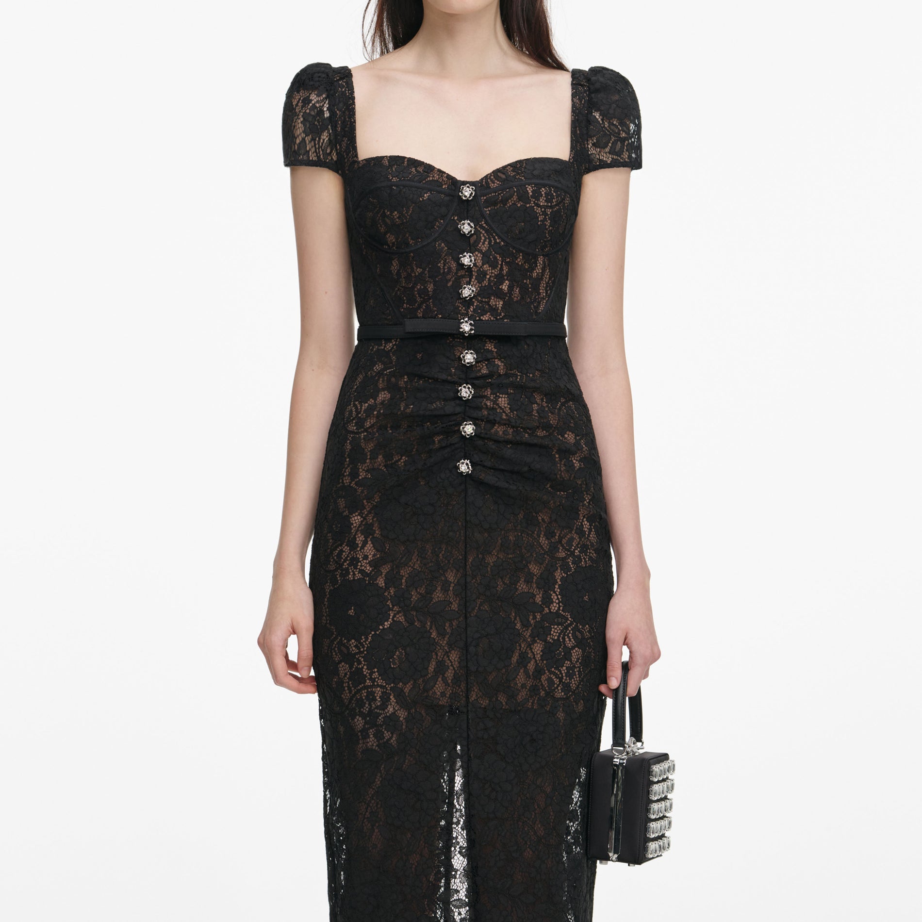 A close up of a woman wearing the Black Sweetheart Lace Midi Dress