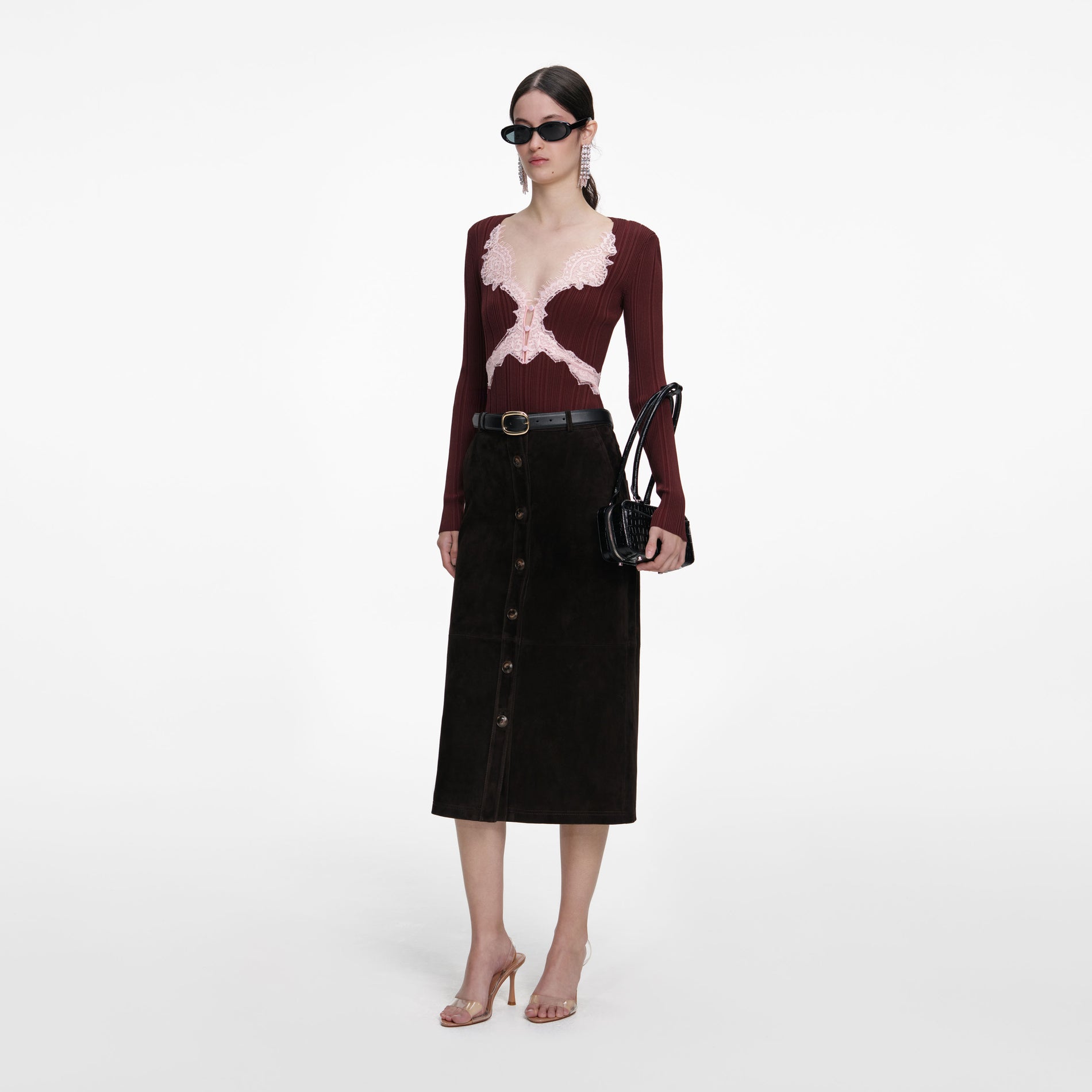 Side view of a woman wearing the Brown Contrast Lace Knit Top