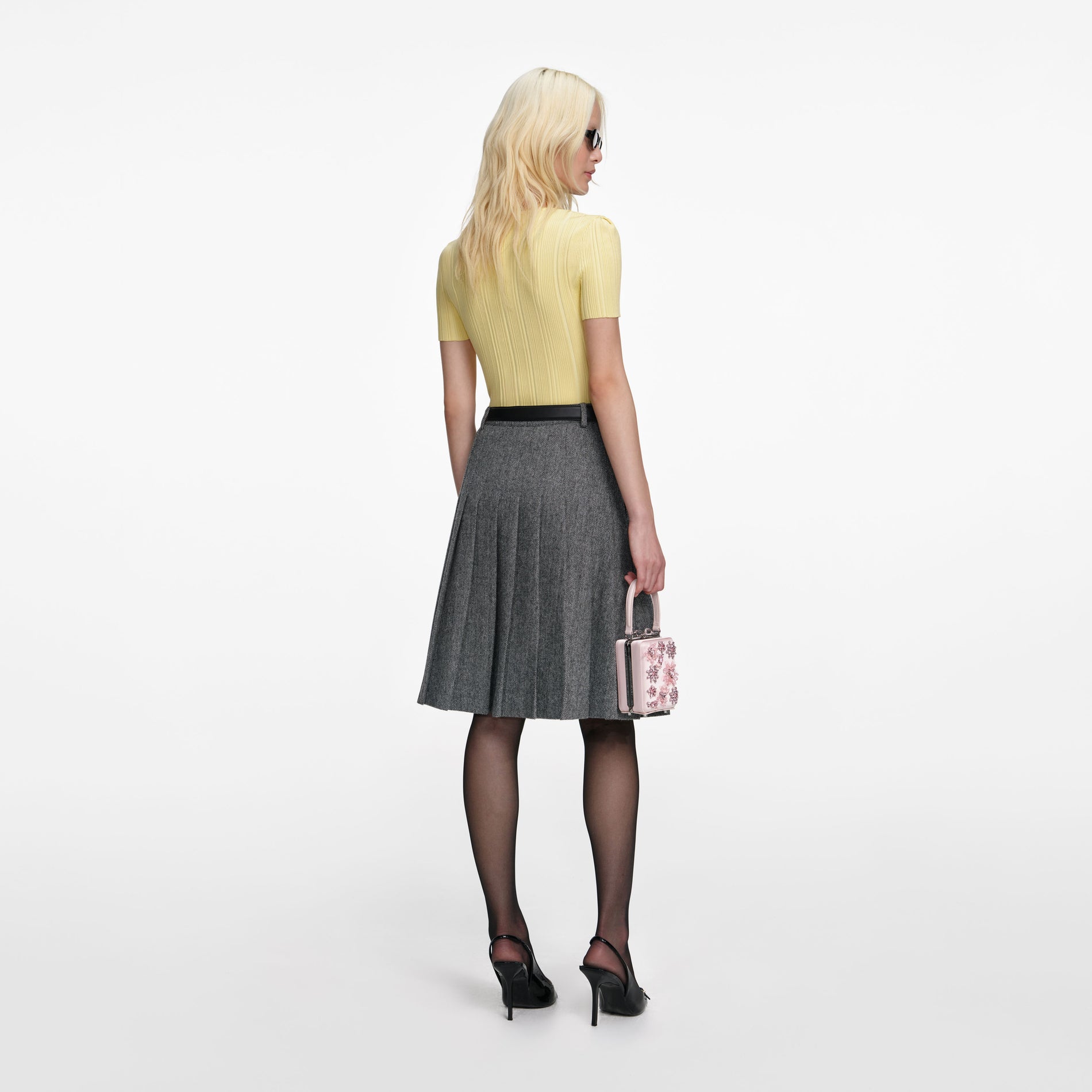 Back view of a woman wearing the Yellow Contrast Lace Knit Top