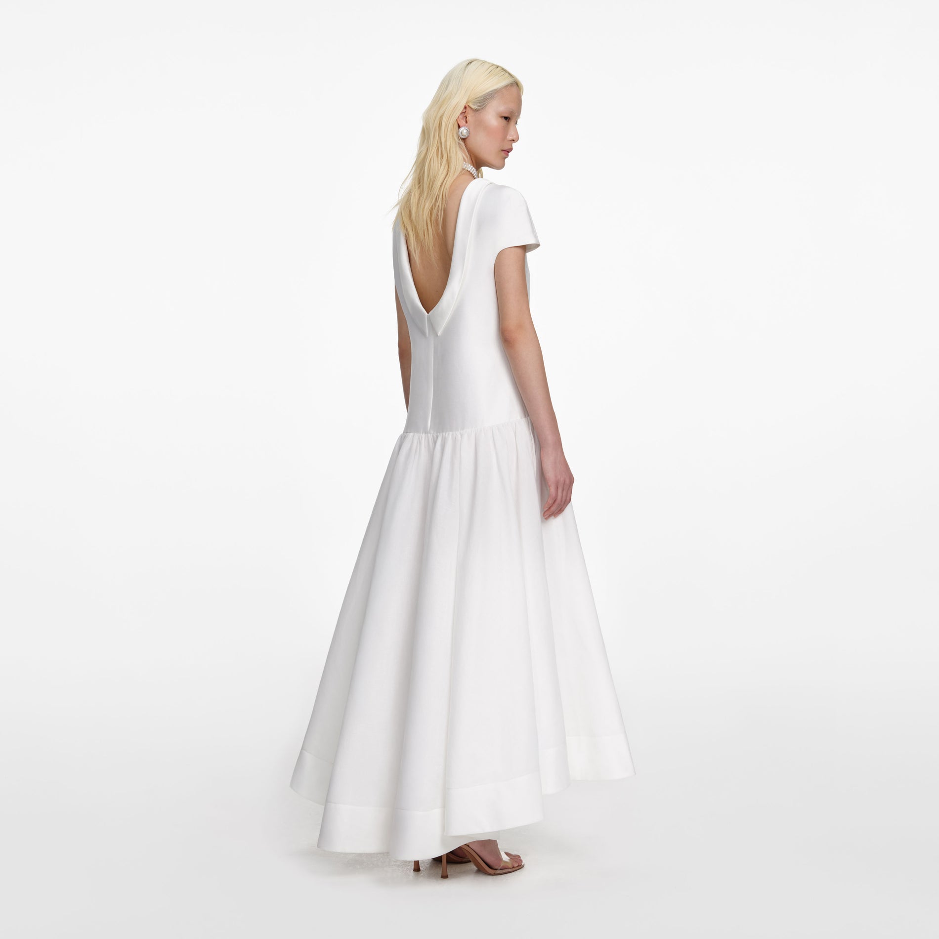 Back view of a woman wearing the White Satin Ramie Midi Dress