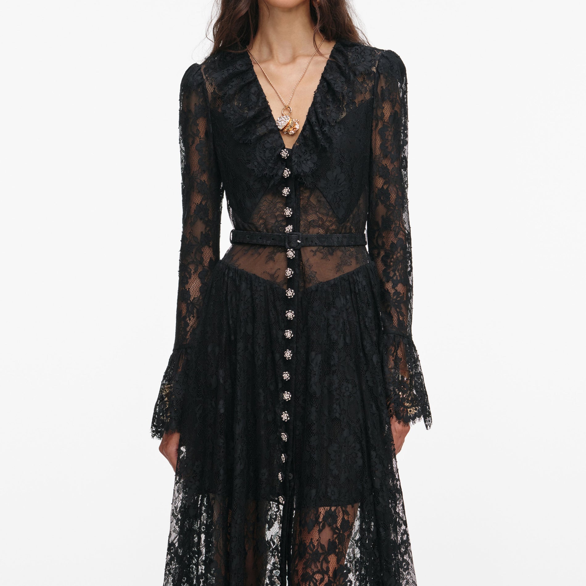 A close up of a woman wearing the Black Lace Ruffle Maxi Dress