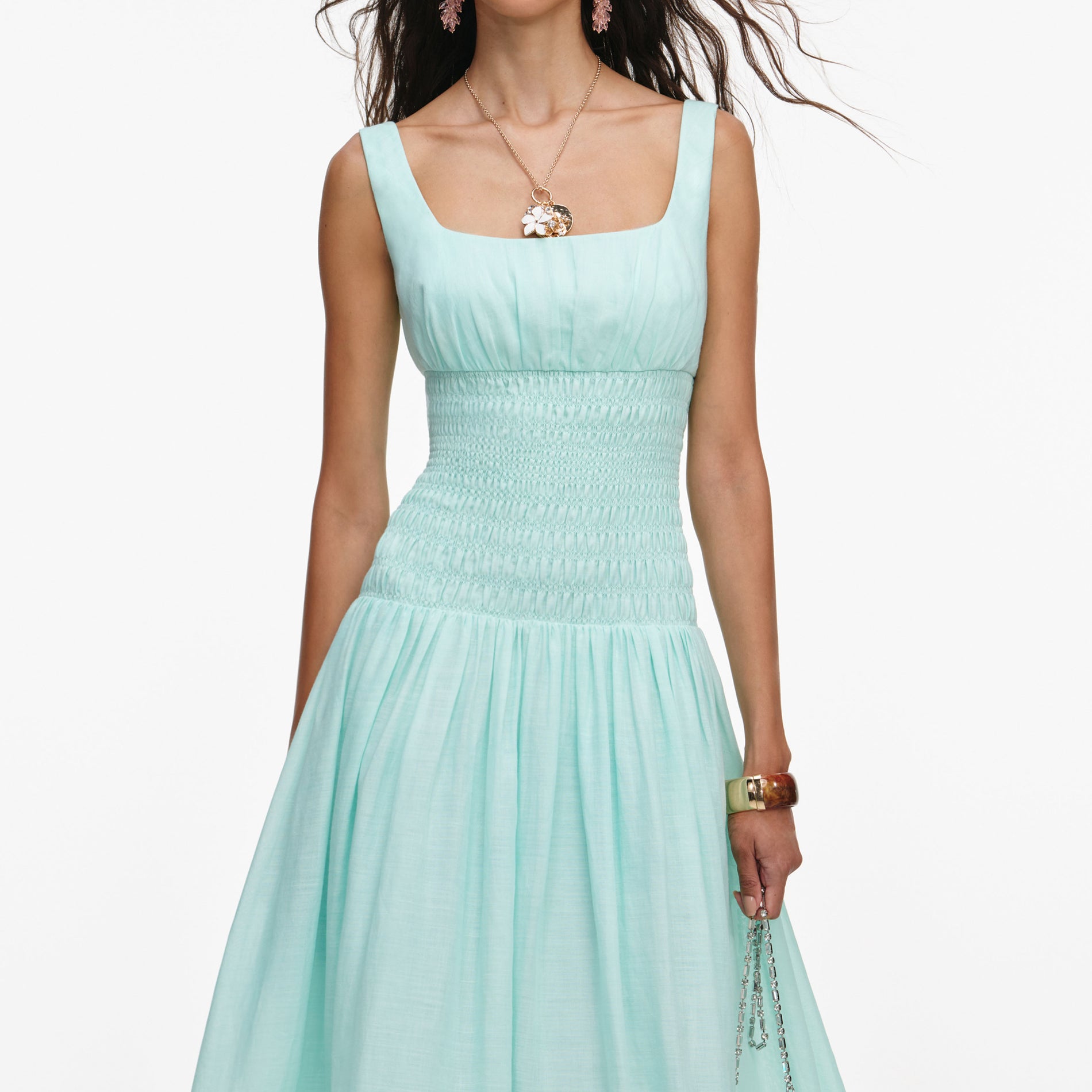 A close up of a woman wearing the Mint Ramie Midi Dress