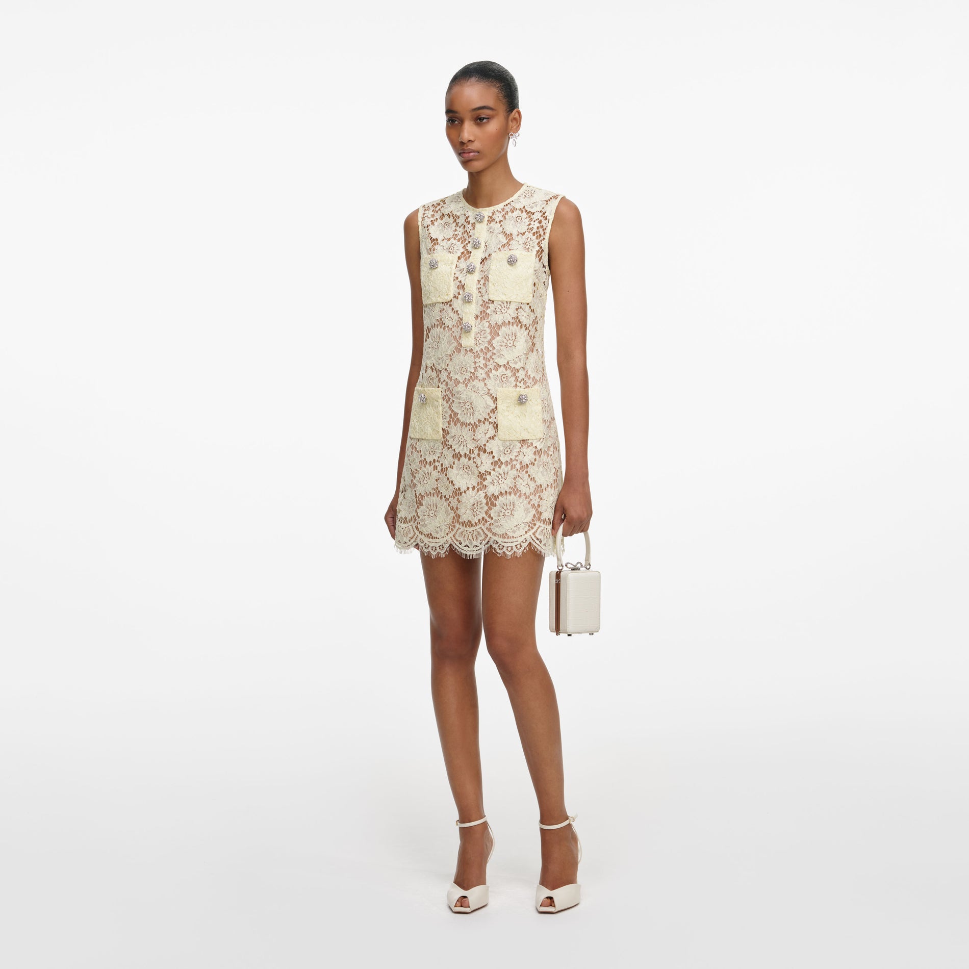 Side view of a woman wearing the Yellow Fine Lace Mini Dress