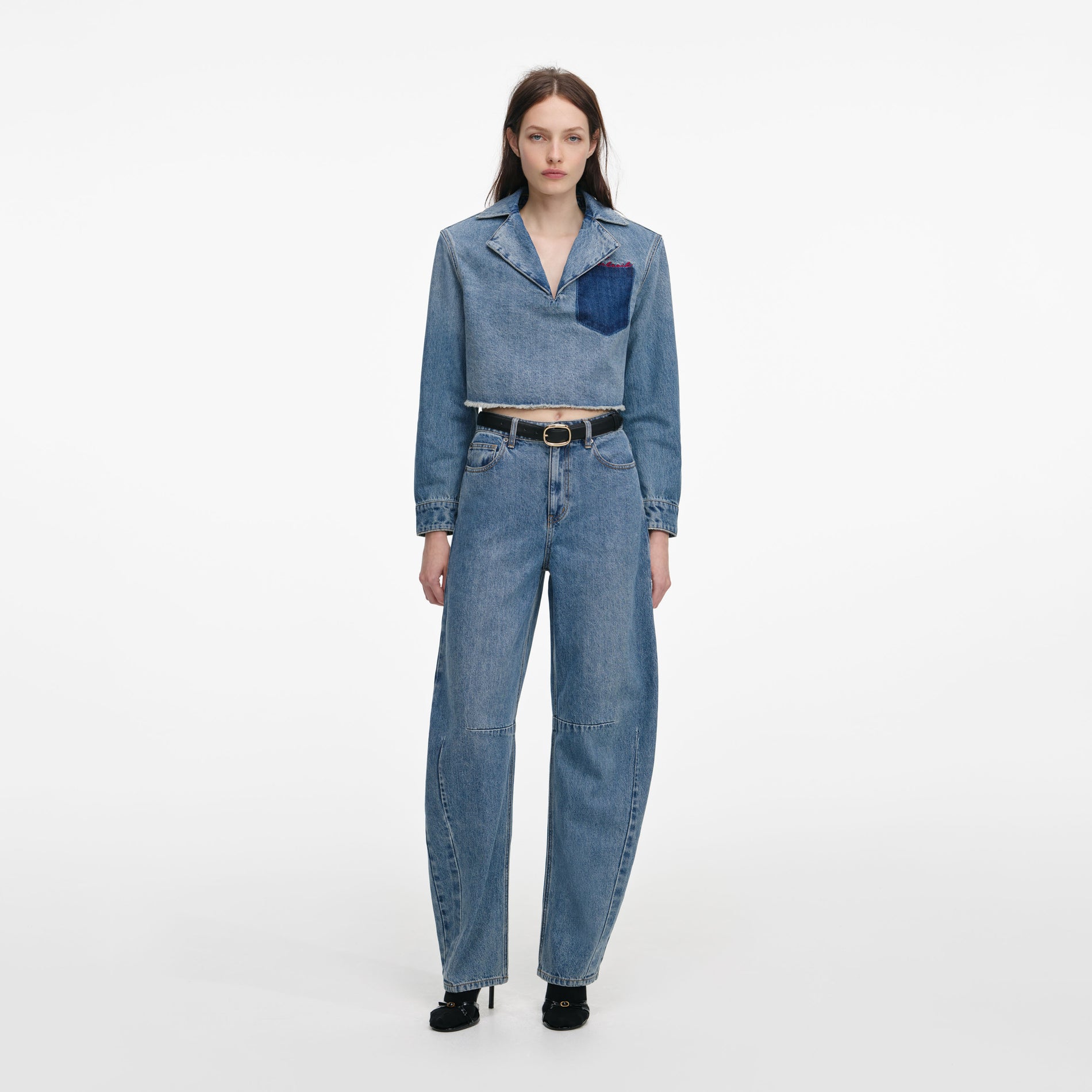 Front view of a woman wearing the Blue Barrel Leg Jeans
