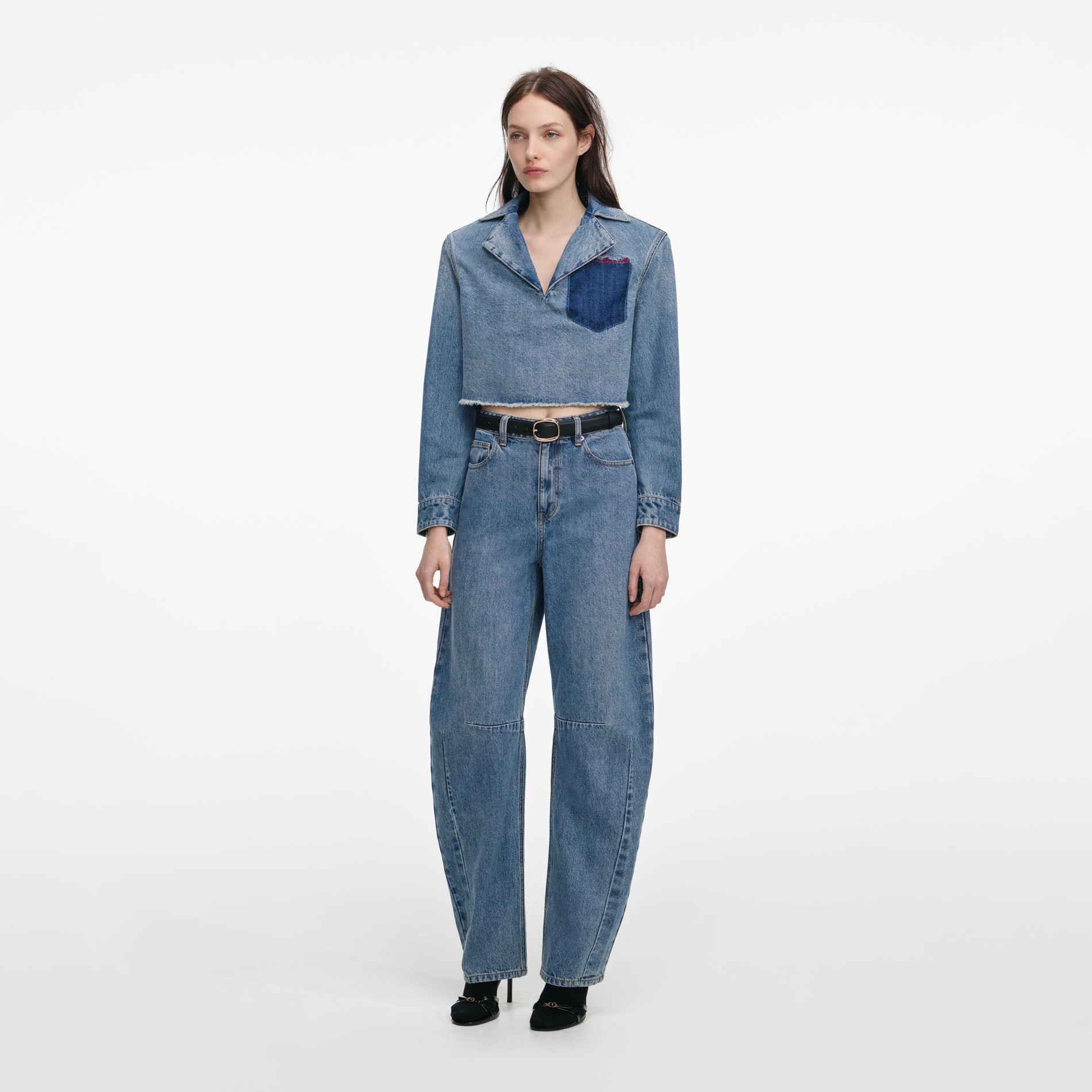 Side view of a woman wearing the Blue Barrel Leg Jeans