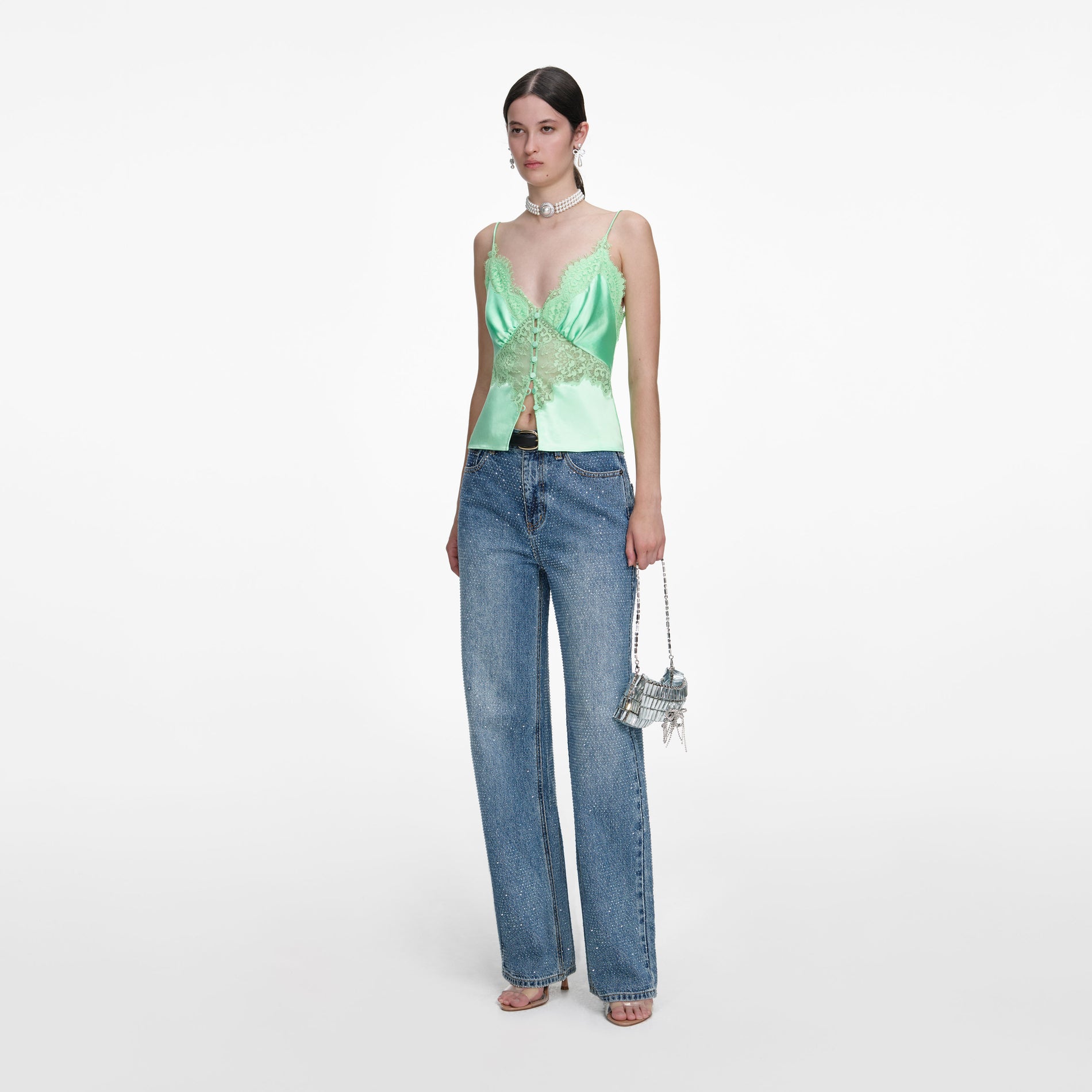 Side view of a woman wearing the Rhinestone Denim Straight Leg Jeans