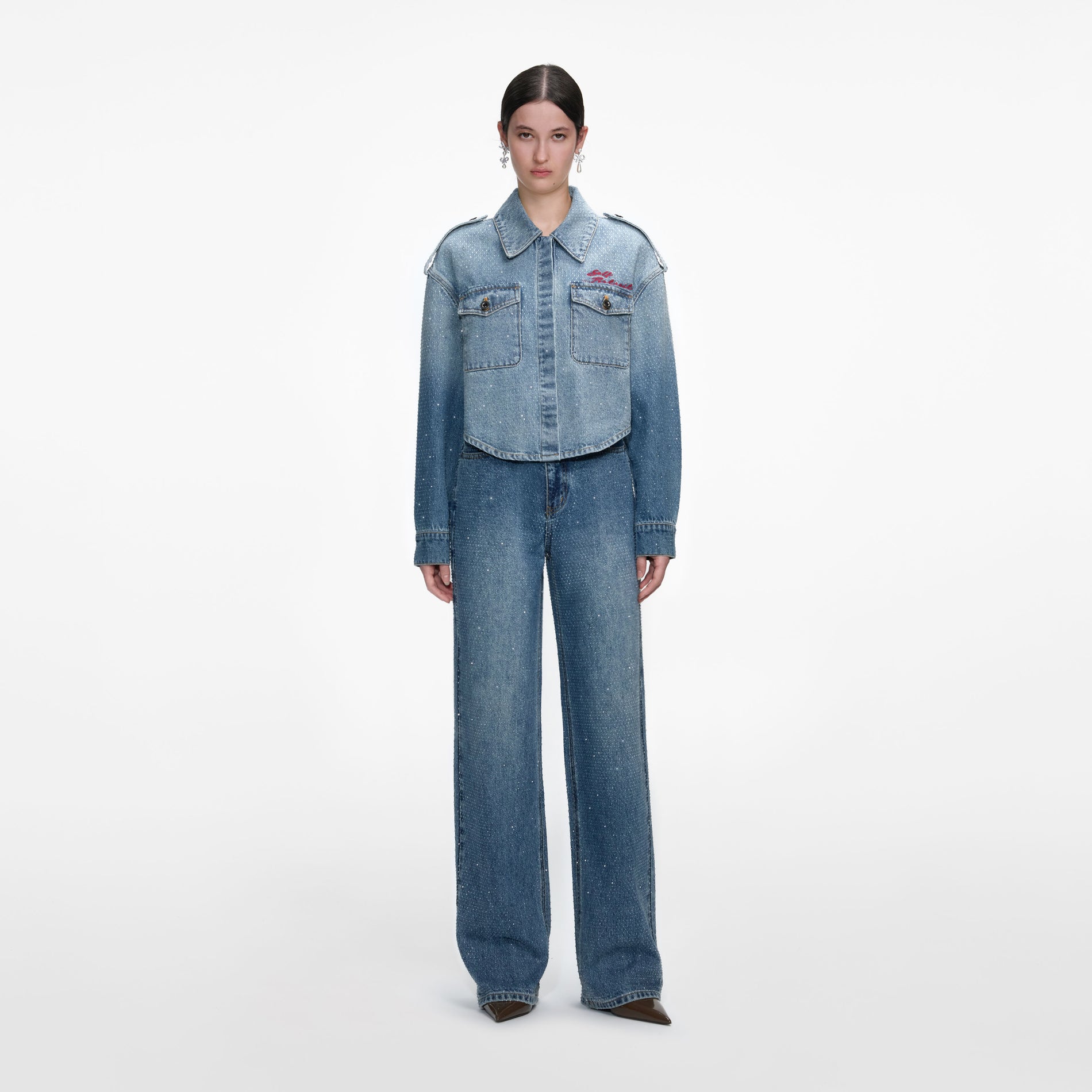 Front view of a woman wearing the Rhinestone Denim Shirt