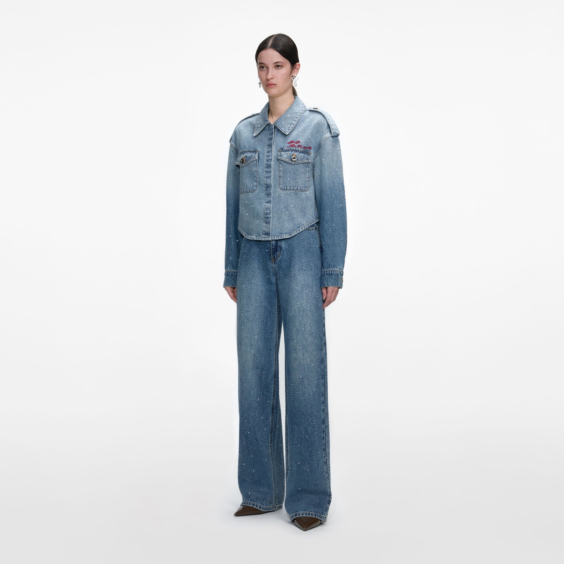 Side view of a woman wearing the Rhinestone Denim Shirt