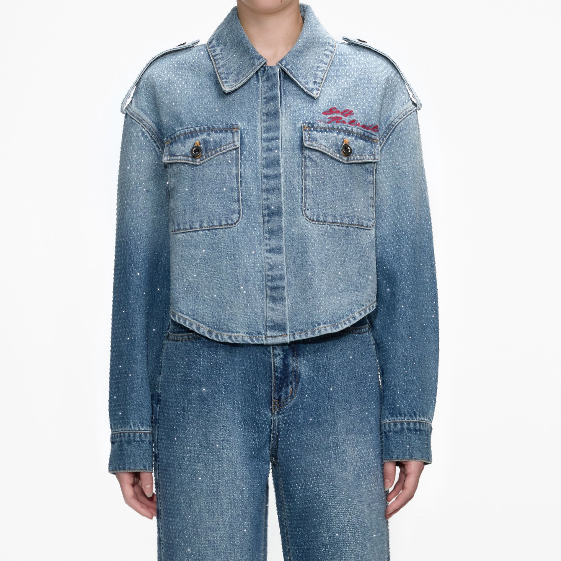 A close up of a woman wearing the Rhinestone Denim Shirt