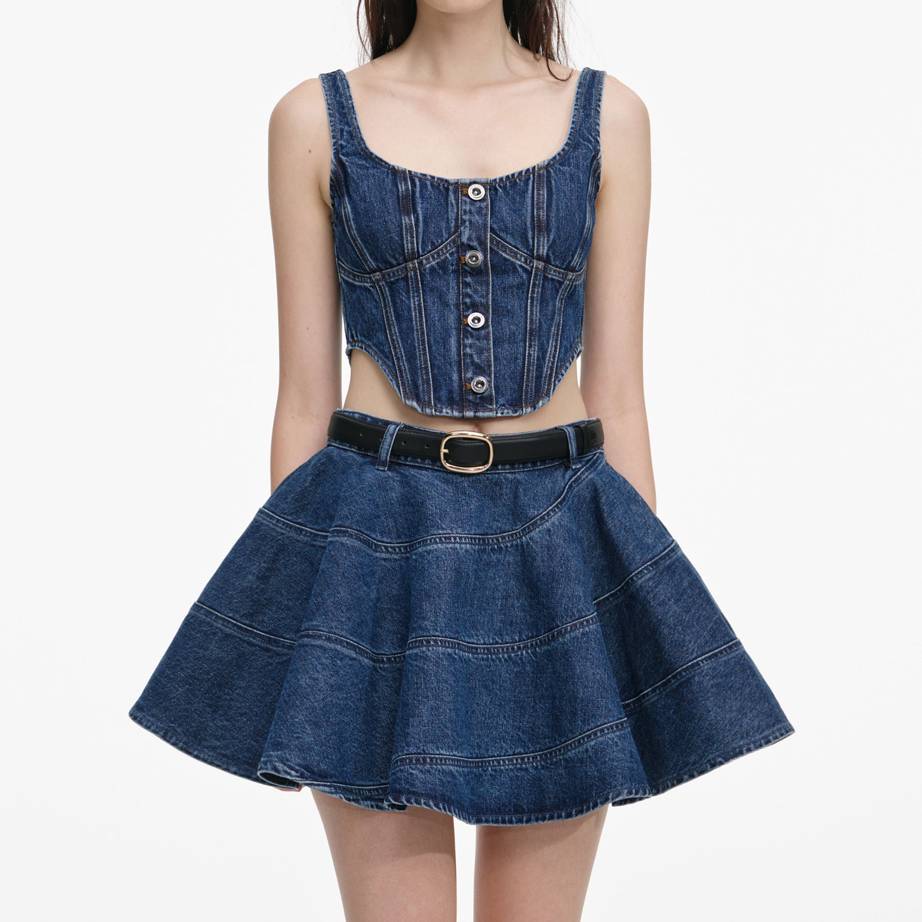 A close up of a woman wearing the Denim Corset Top