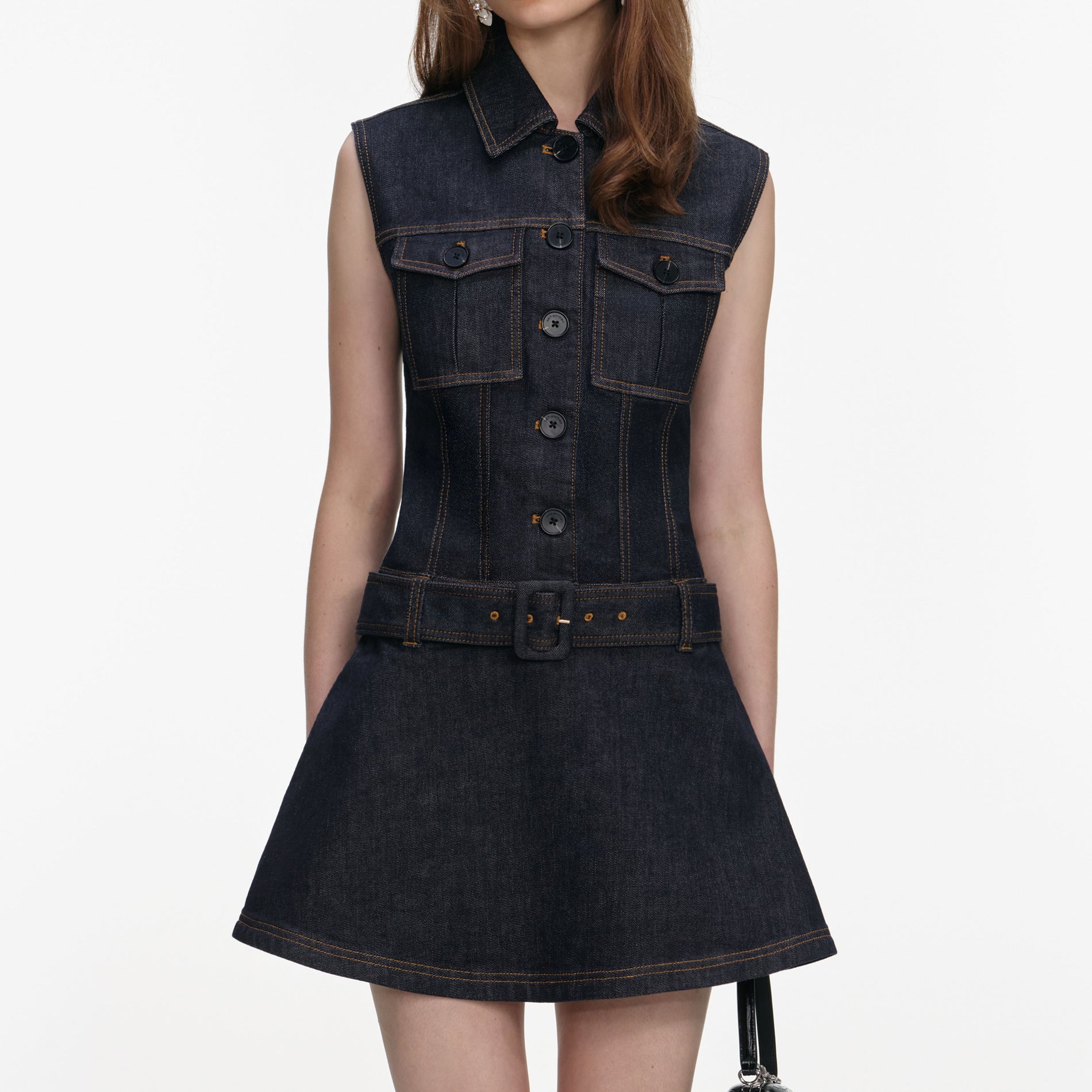 A close up of a woman wearing the Indigo Denim Flared Mini Dress
