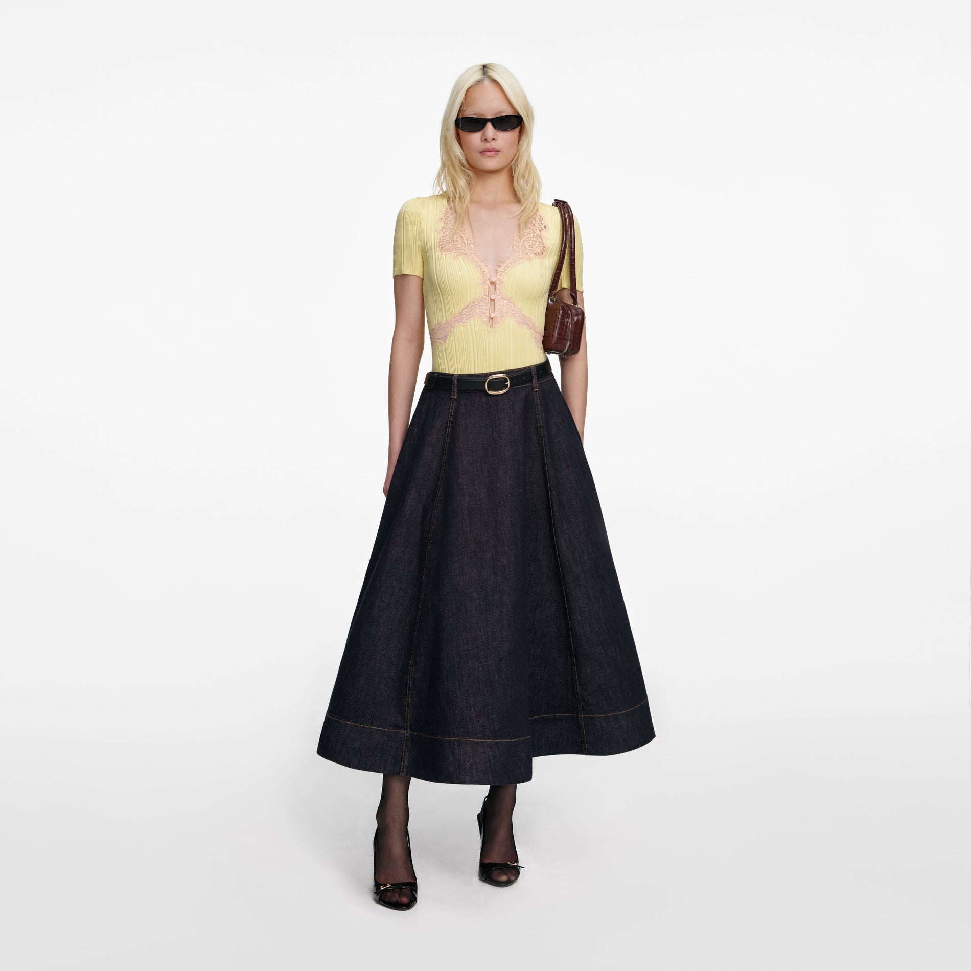 Front view of a woman wearing the Indigo Denim Flared Midi Skirt