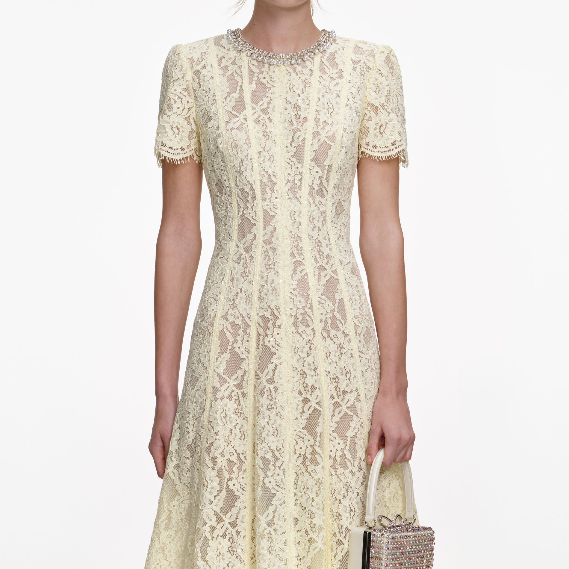 A close up of a woman wearing the Yellow Lace Embellished Midi Dress