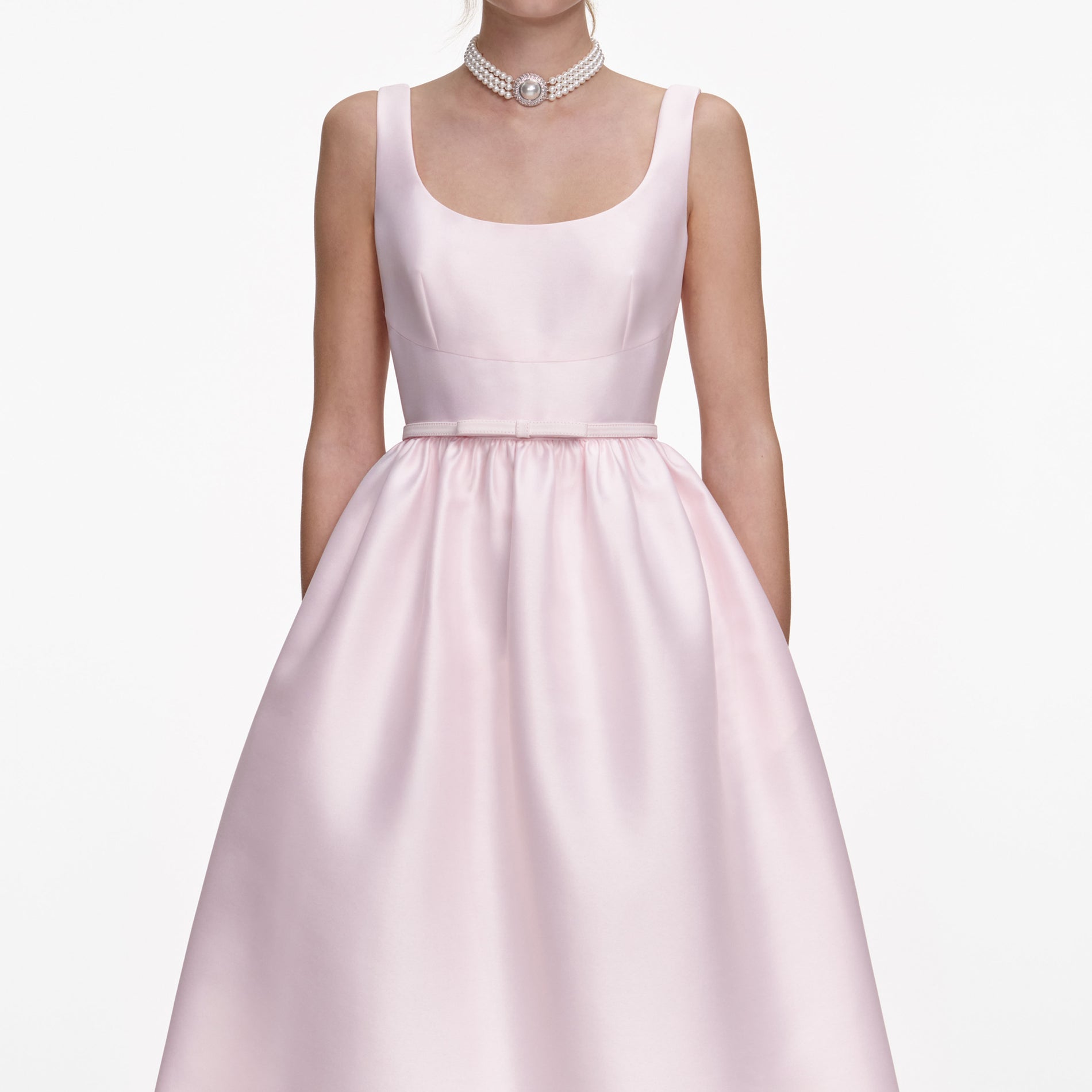 A close up of a woman wearing the Pink Taffeta Midi Dress