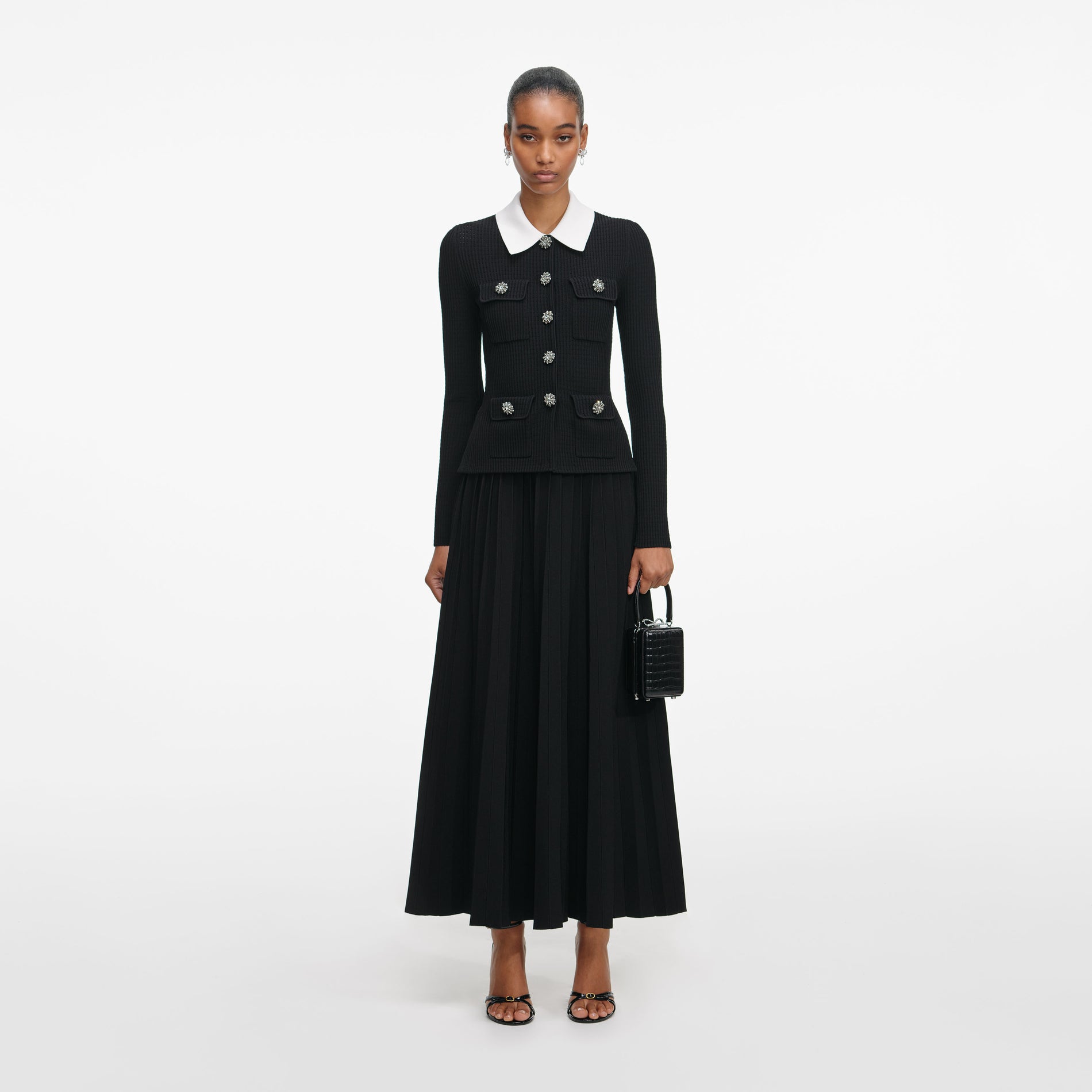 Front view of a woman wearing the Black Tailored Knit Midi Dress