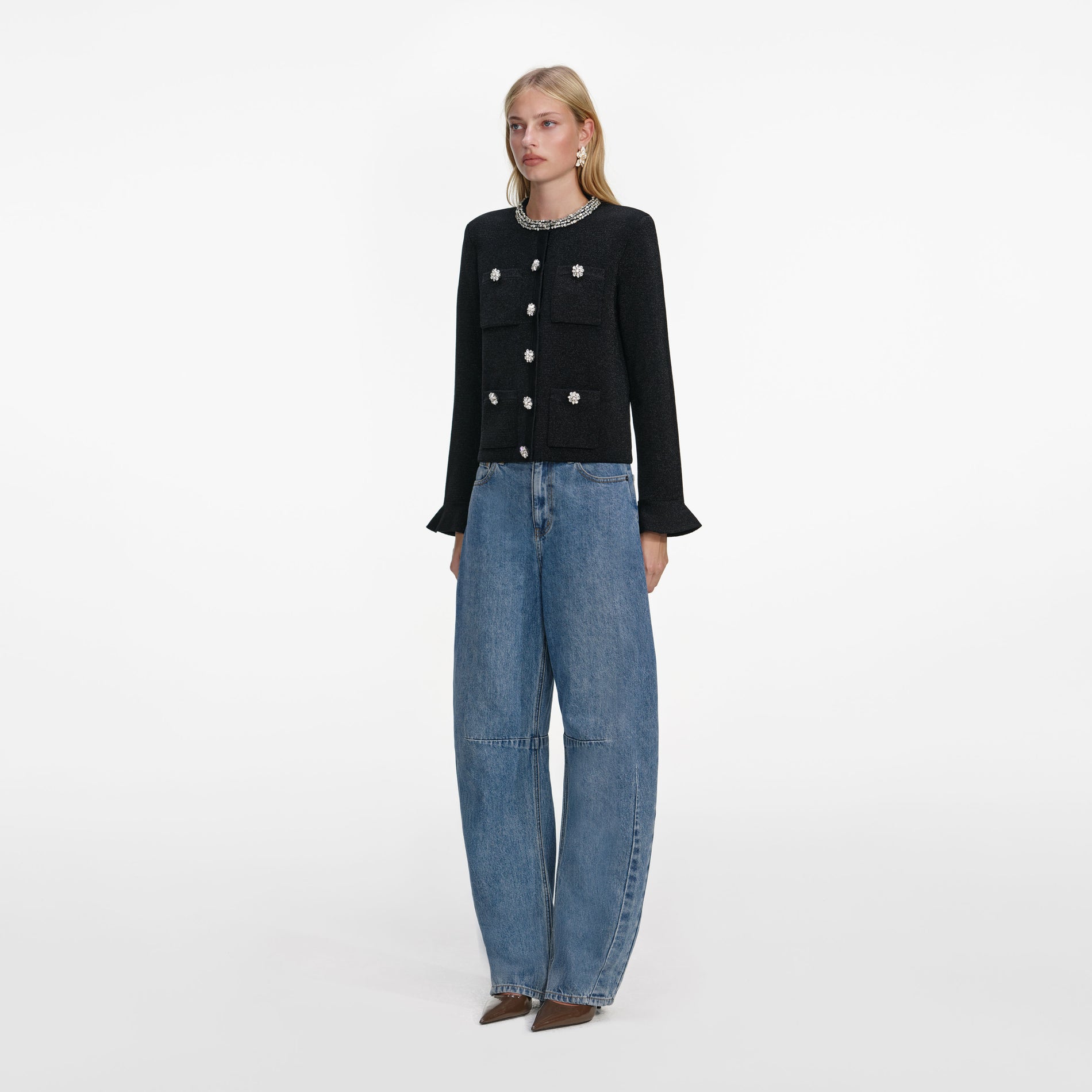Side view of a woman wearing the Black Crystal Button Cardigan