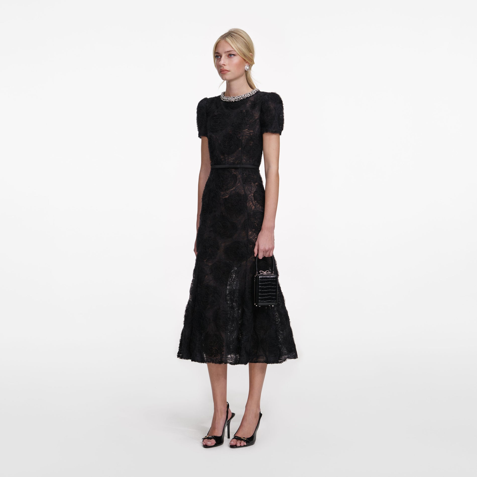 Side view of a woman wearing the Black Tulle Lace Midi Dress