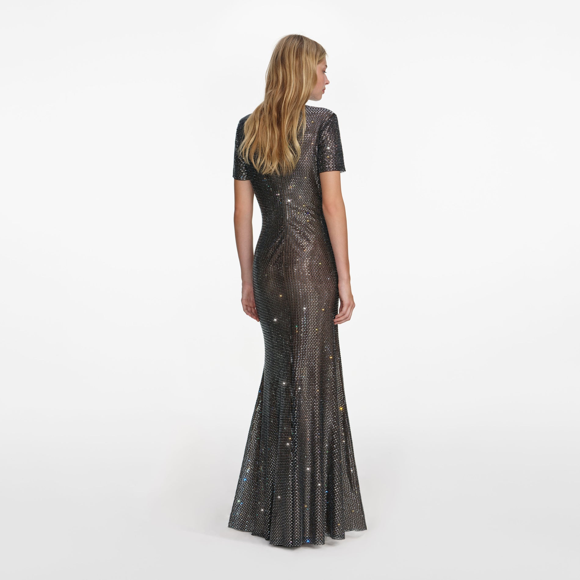 Back view of a woman wearing the Gunmetal Rhinestone Mesh Maxi Dress