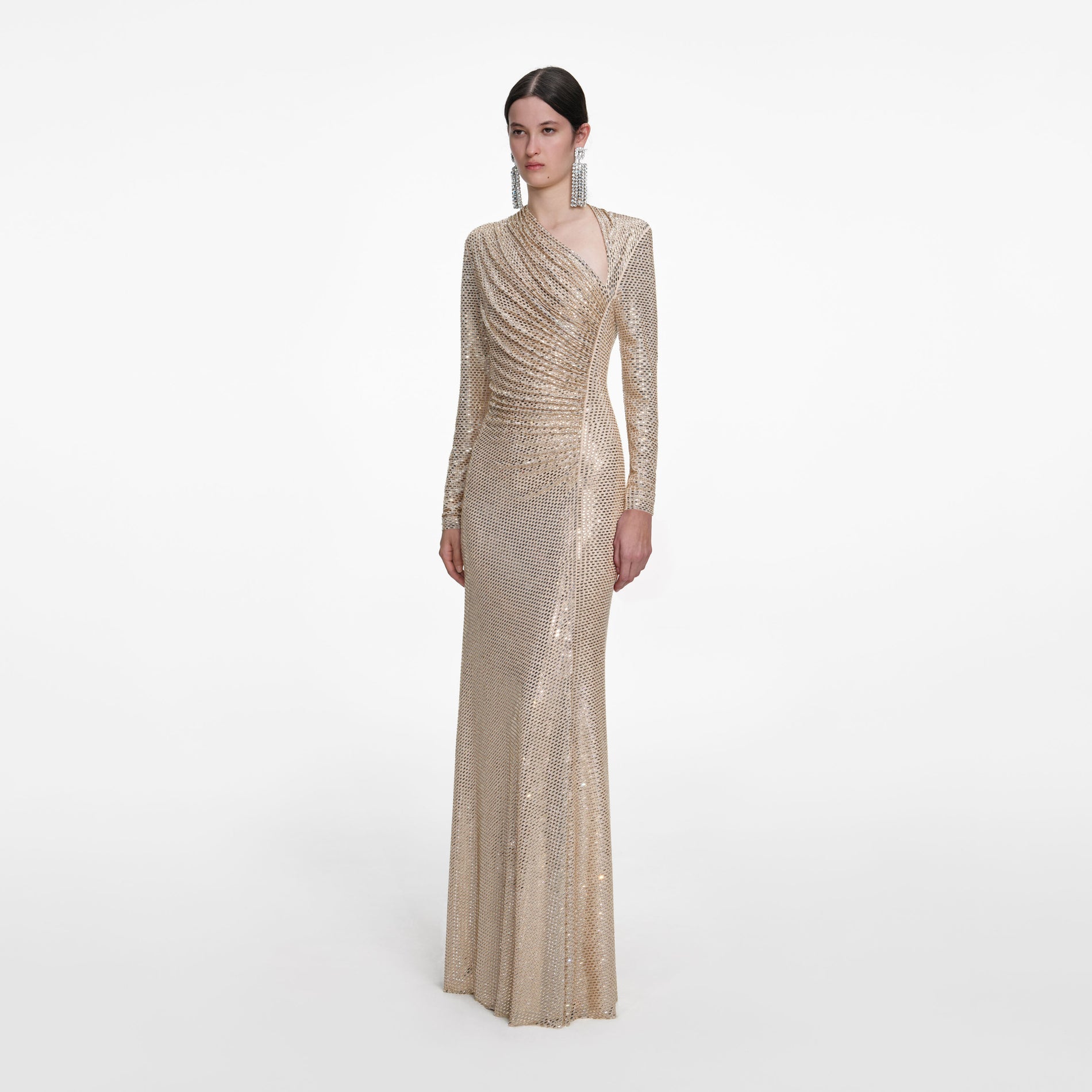 Side view of a woman wearing the Champagne Rhinestone Drape Maxi Dress